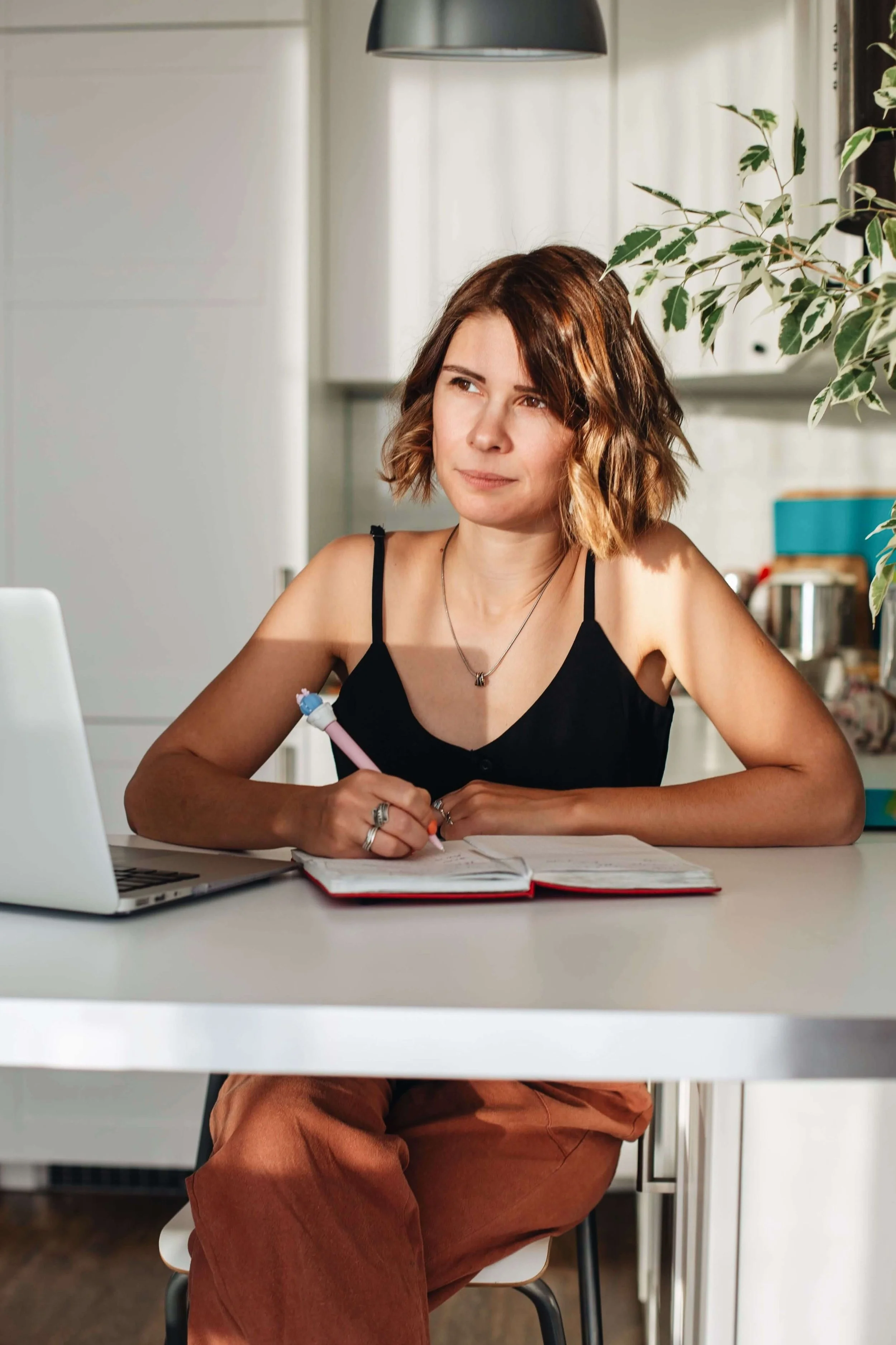 Young woman studying French and thoughtful