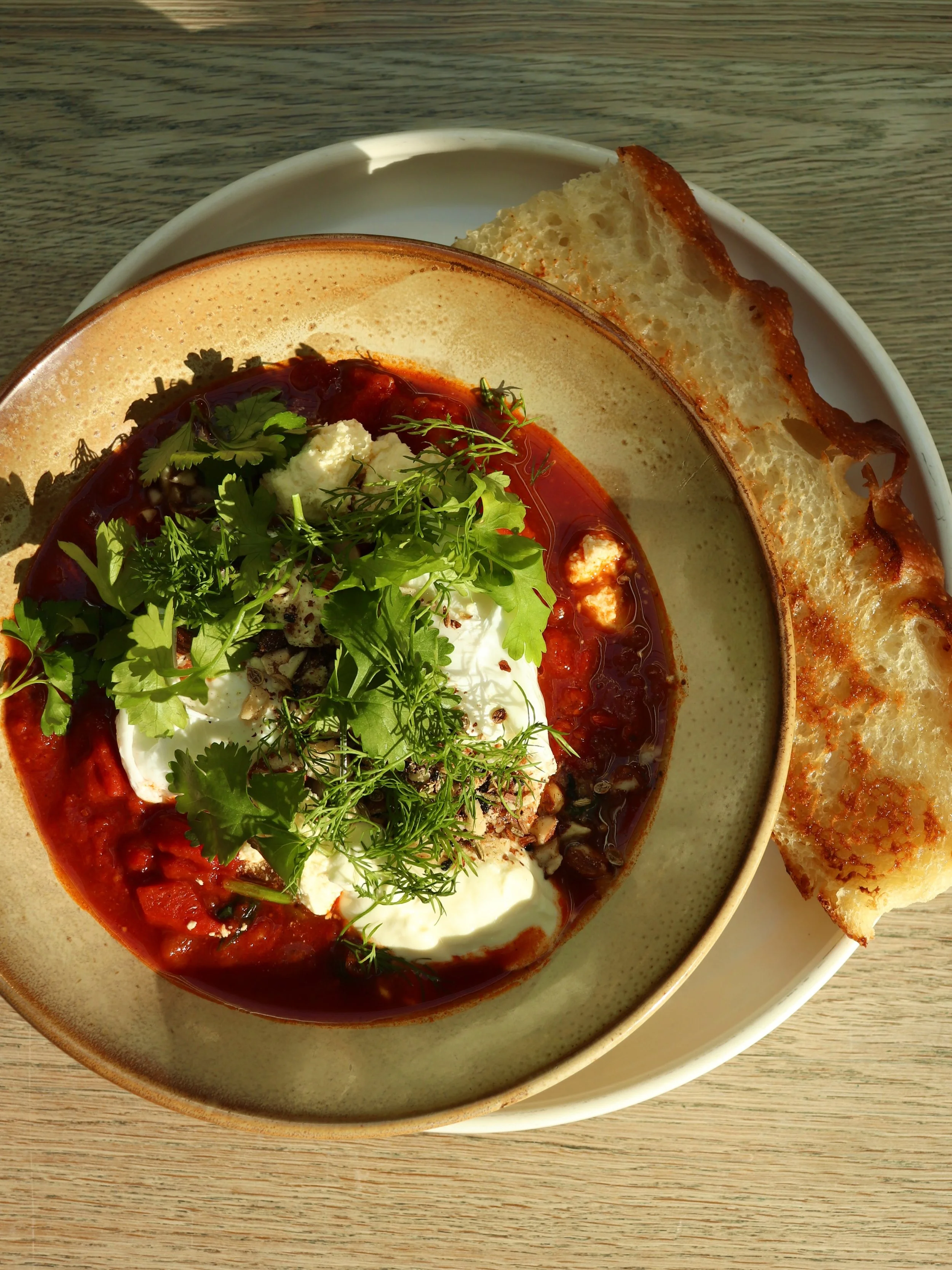 Your winter warmer favourite is BACK 🔥
Fire-Roasted Capsicum Shakshuka w/ Poached Eggs, Greek Yoghurt, Hazelnut Dukkah, Feta, Soft Herbs &amp; Focaccia. Available all day, all winter long.