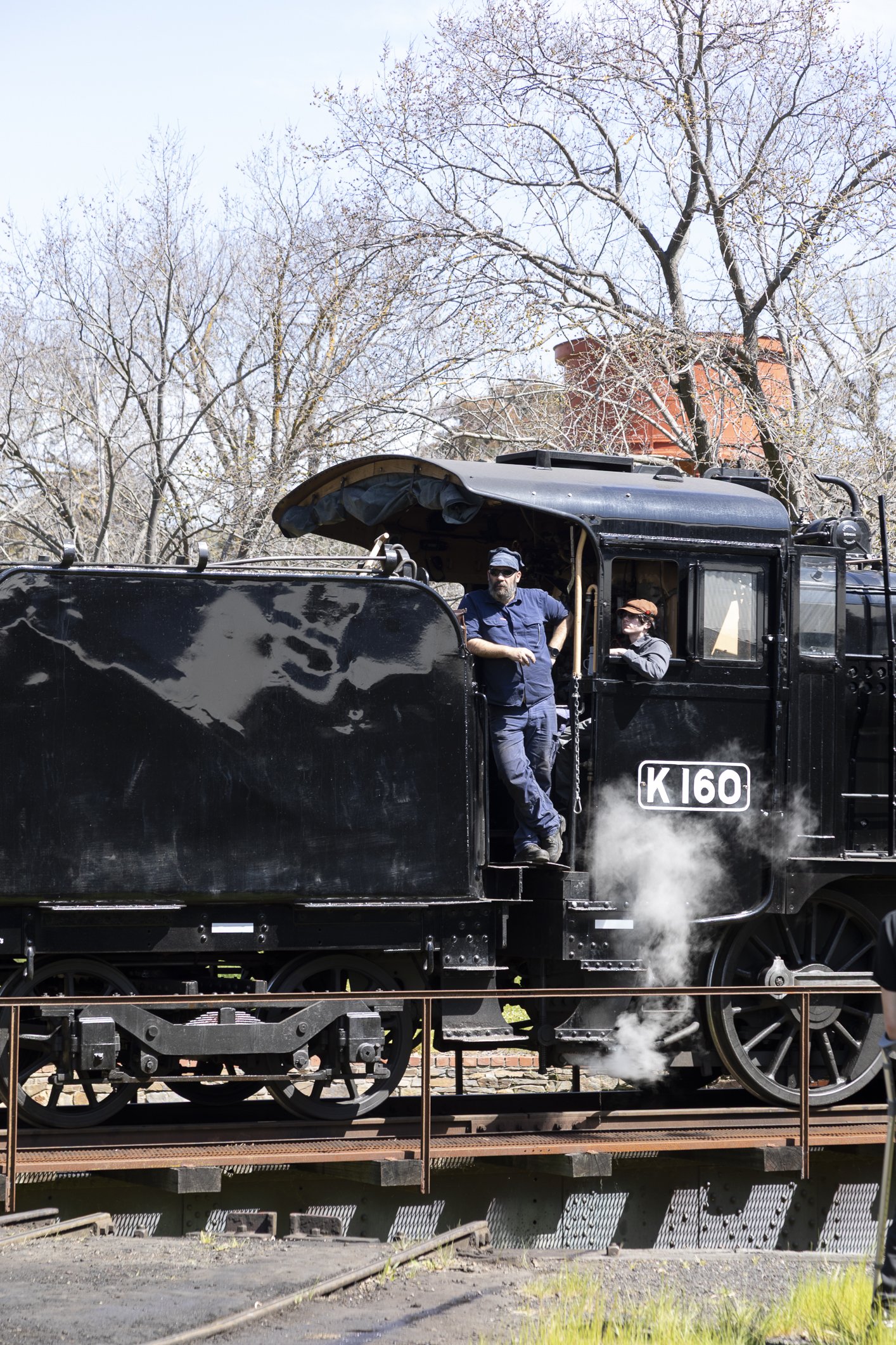 K 160 on the turntable at Maldon on the Victorian Goldfields Railway, with driver Rob standing in the doorway. Scott Gould A Railway Life Photography