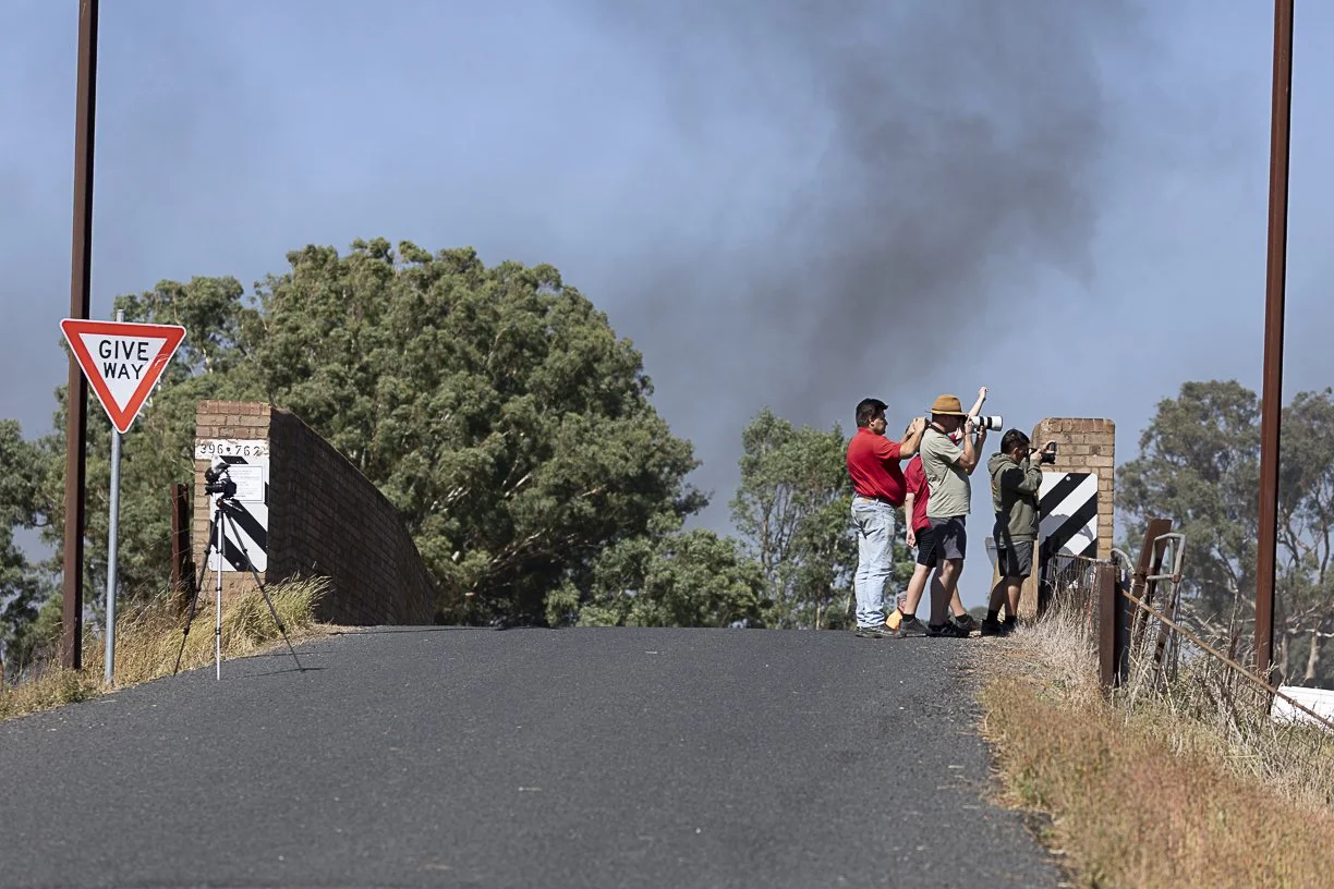 The Picnic Train hauled by steam loco R 766 has just passed under the bridge at Colorado Road, west of Harden on its first trip down the Main South, with photographers capturing a shot as the smoke hangs above them. Scott Gould A Railway Life