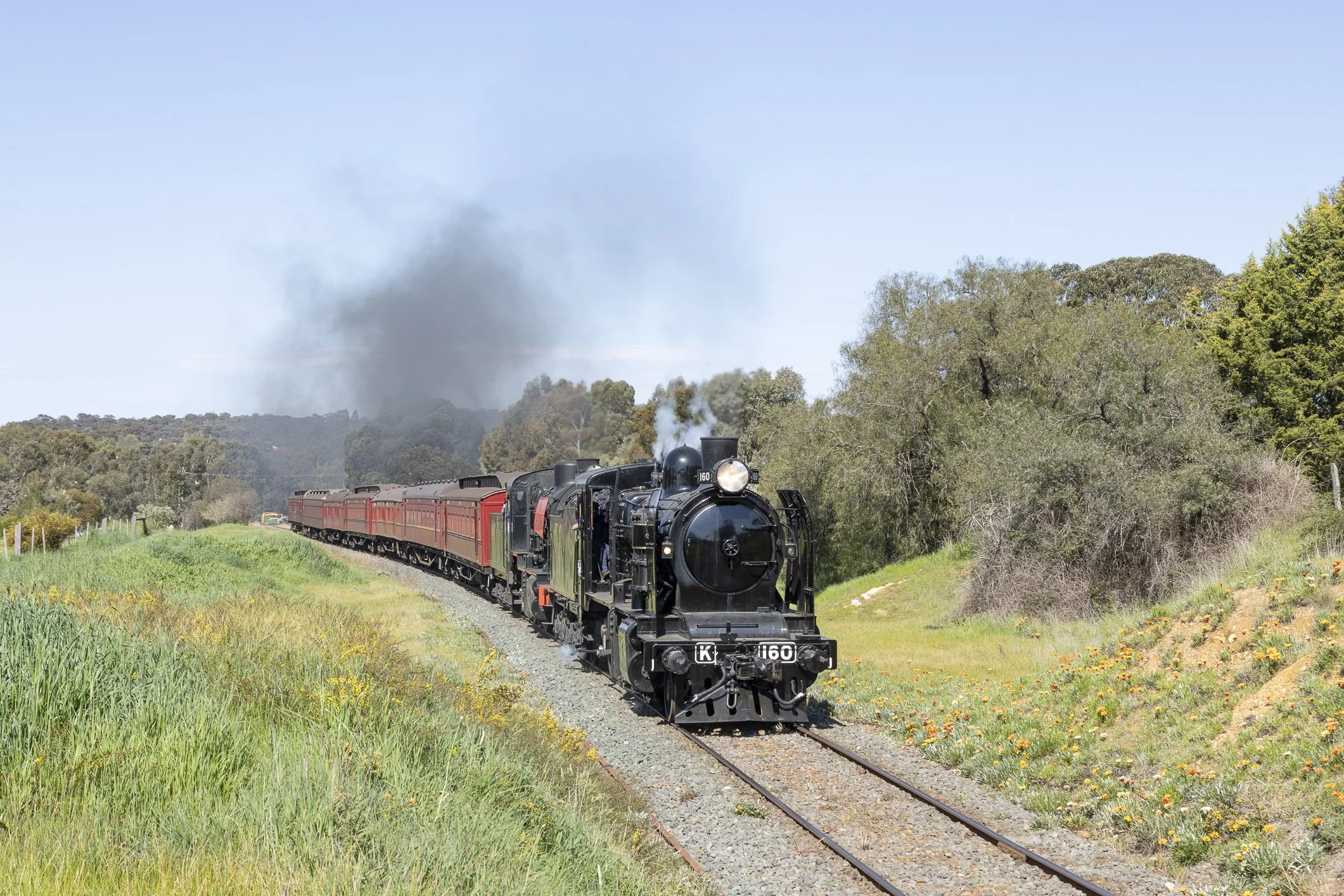 Steam Locos K 160 and J 549 lead a train from the Winters Flat bridge in Castlemaine on the Victorian Goldfields Railway. Scott Gould A Railway Life Photography