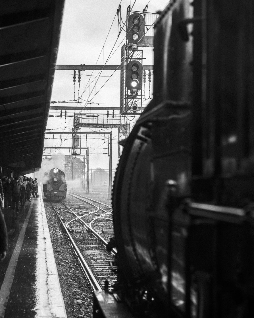 black and white railway photography fine art photo Taken by Scott Gould A Railway Life fine art photography FRONZ 50th anniversary Palmerston North JA 1271 and Ab 608 steam locomotives face each other in light rain
