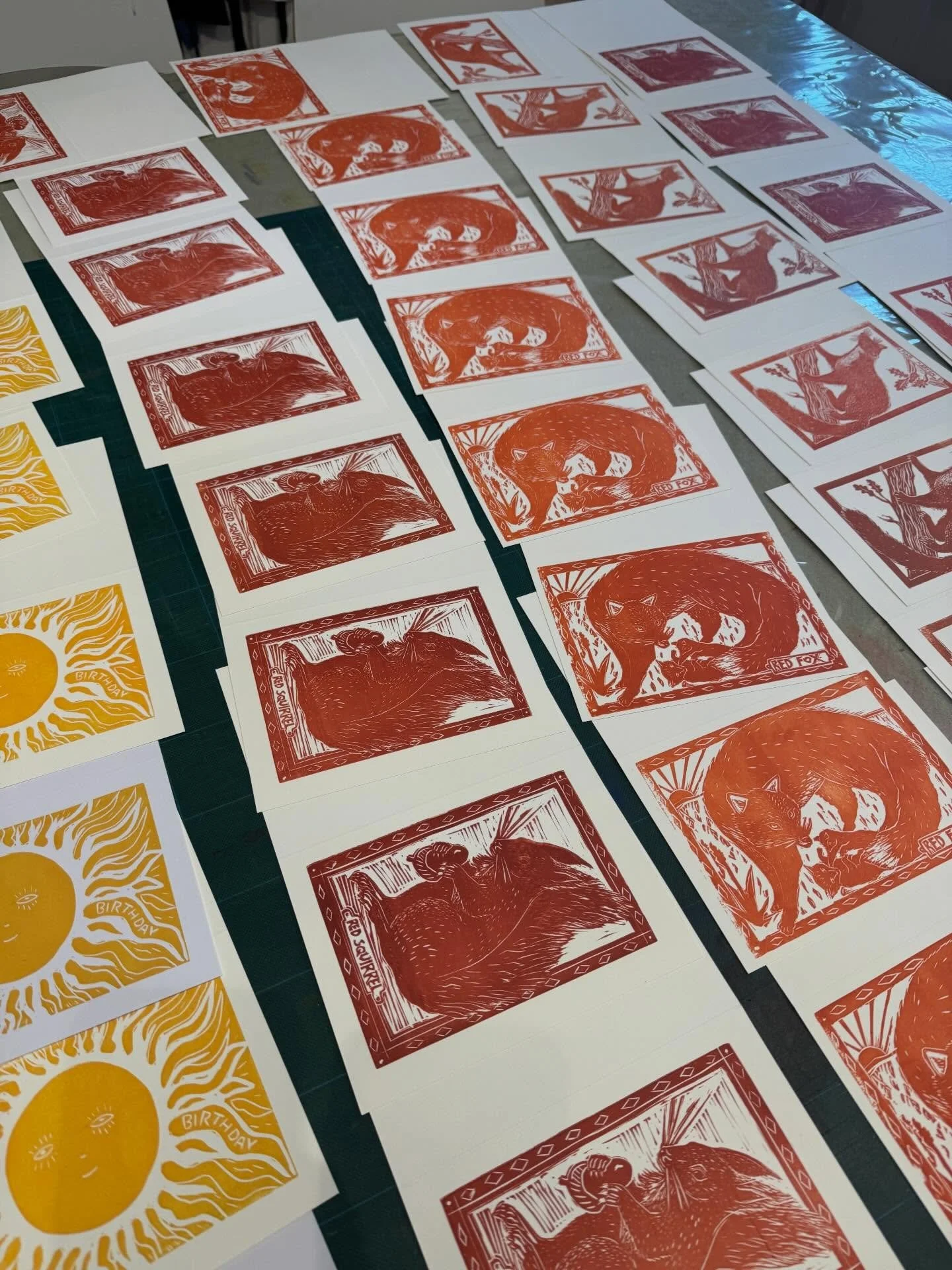 Freshly printed cards and bird garlands in the studio in summery colours to brighten up this drizzly day. We ink up and print each one by hand 🖐️