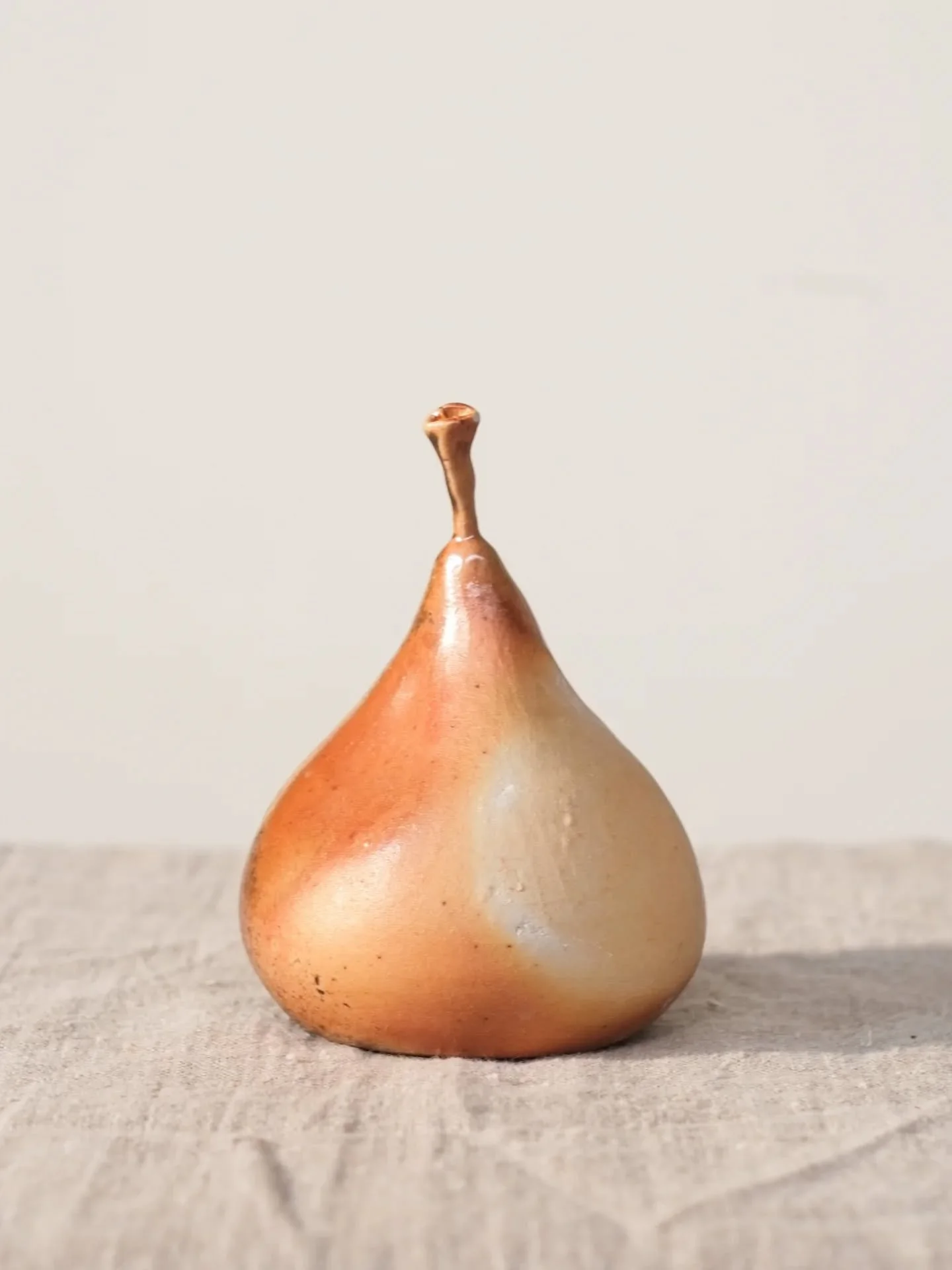 These are some wood-fired pears. The first pears I'd ever made. I've got quite a few more in the gas kiln that I'll be opening tomorrow, I'm beyond excited about them. Some are covered in lots of ash that I collected from my pottery wood burner last 