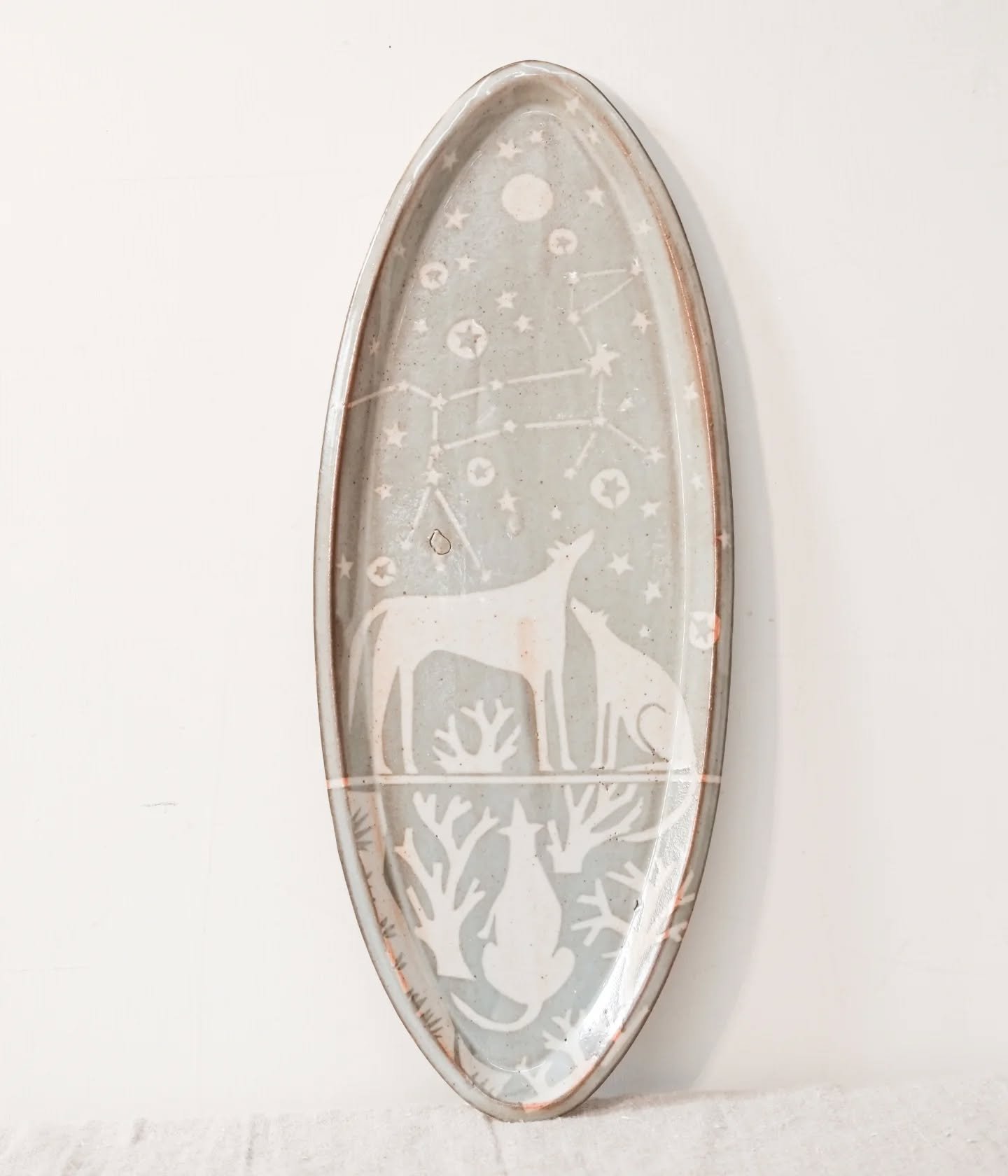 One of my favourites so far, 'The Great Dog Constellation Platter'  with Sirius the dog star shining bright. Three dogs are gathered to gaze up at the sky, I wonder what they are thinking?

I've been busy making again and I'm hoping that some pieces 