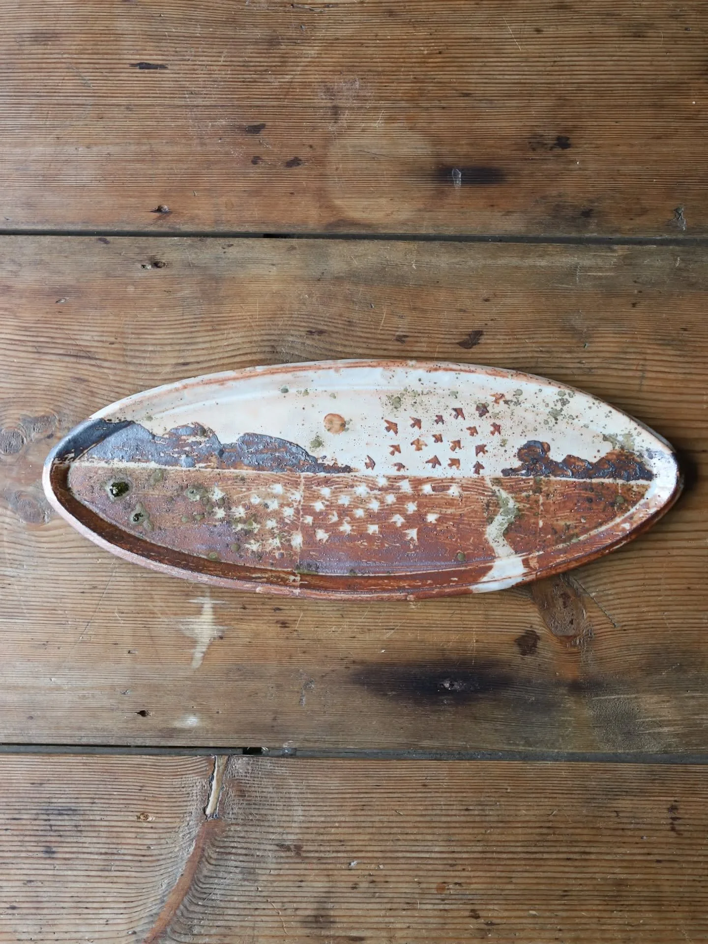 The Starling Murmuration Platter. Made using three different clays, all with varying iron oxide contents and finished off with a generous sprinkling of ash from my studio wood burner. The starlings are one of the highlights of winter when I'm at glaz