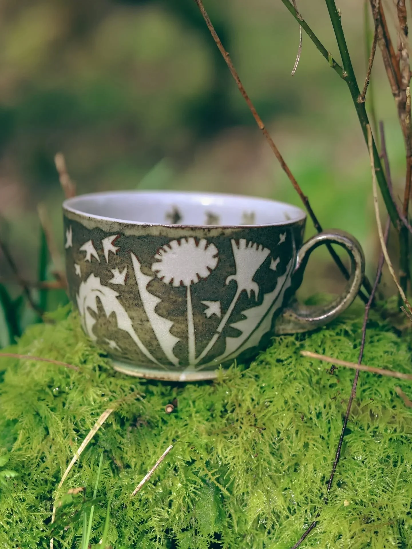 This dandelion mug was pretty special, so I've made a few more. Today is the start of glazing. I need to unload the bisque kiln, wax bottoms, load the car up with pots and glazes and head off to the gas kiln. 

I'm not sure what it is about dandelion