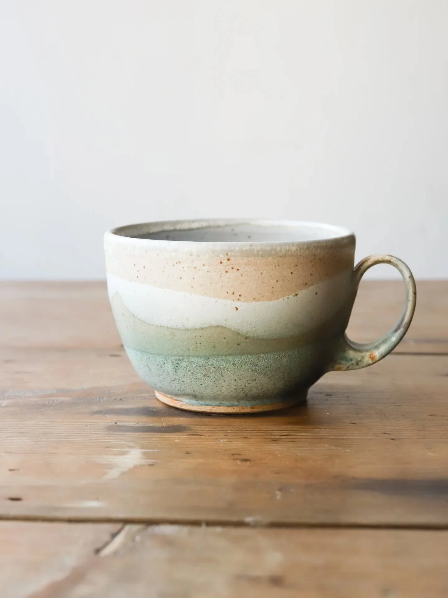 Some rounded cups from last month's work. I stupidly forgot to make them this month. I had prepared all the clay to make them and then got carried away and turned them all onto tapered mugs! Oh well. I'm glazing today and tomorrow, I'm looking forwar