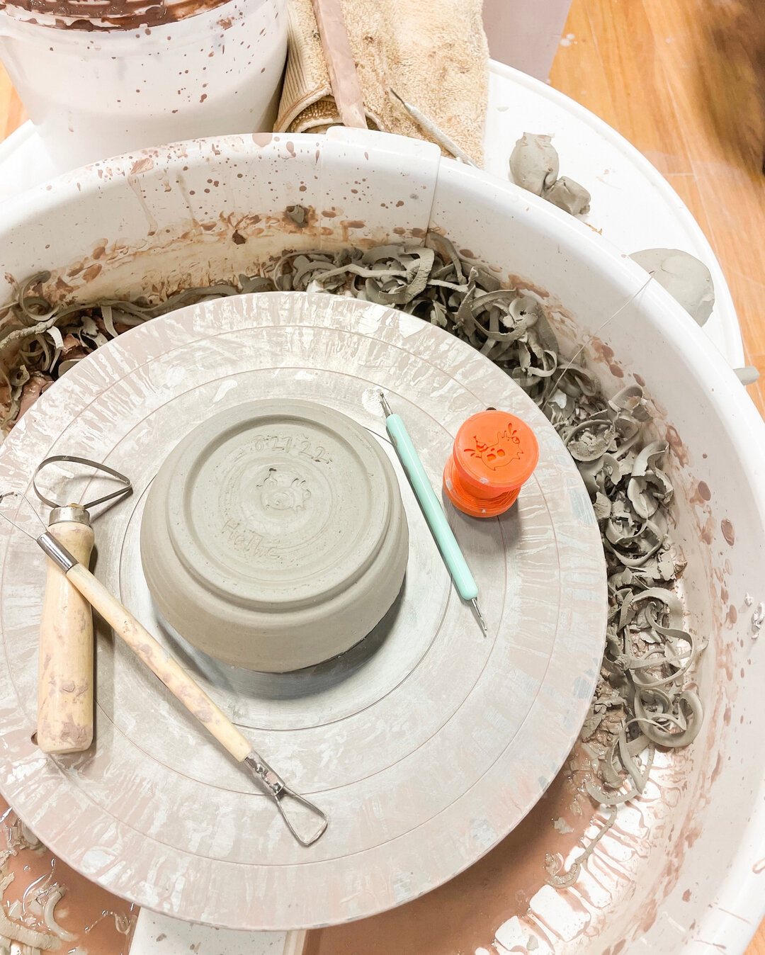 Every Tuesday is full of trimming! Each piece made from Private Lessons or a Try-It class is trimmed by one of our staff members to clean up the pieces, give them a foot and a stamp with our logo!