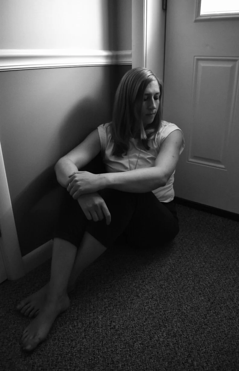 I used limited light and a pensive pose to create this portrait. Title: 'Pensive'