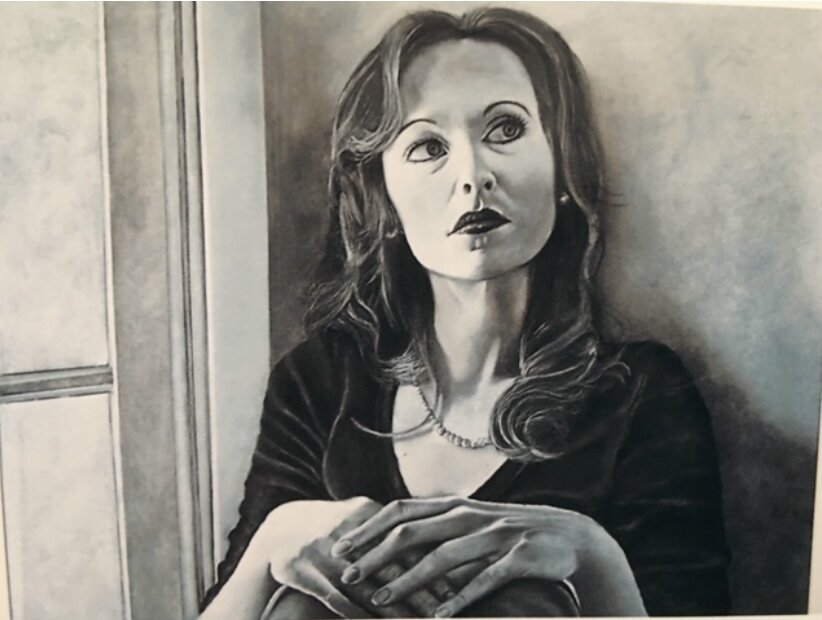 This portrait drawing is done in charcoal pencils, measures 16" x 22" and is titled, "Portrait of Britany'./ $300.00