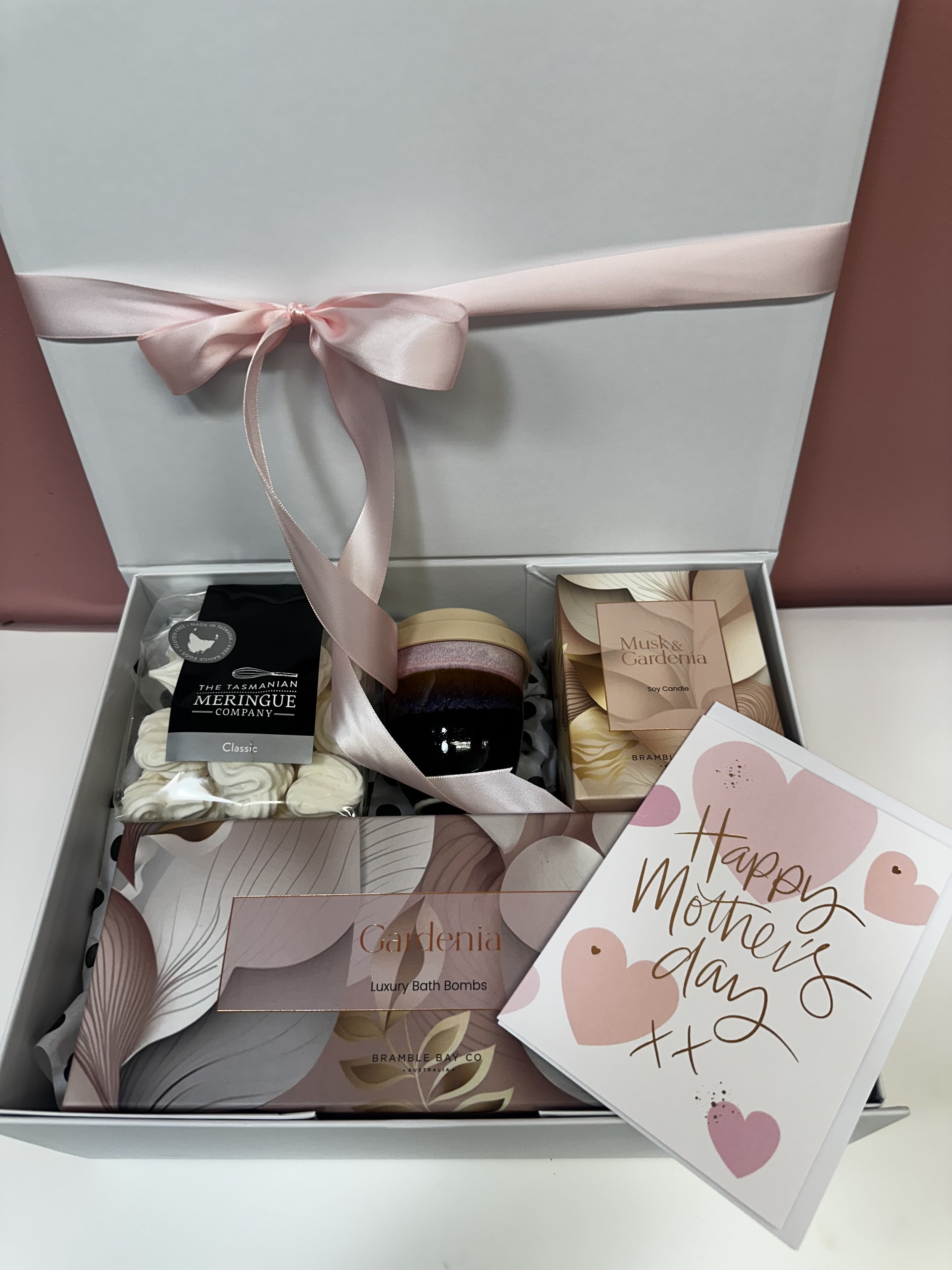 Mother's Day Pamper Gift includes luxury bath bombs, musk and gardenia Soy Candle, Pottery for the Planet keepcup, meringues in white hamper box with magnetic lid