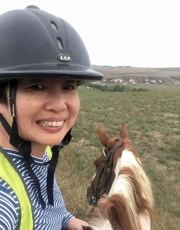 Jacqueline riding a horse