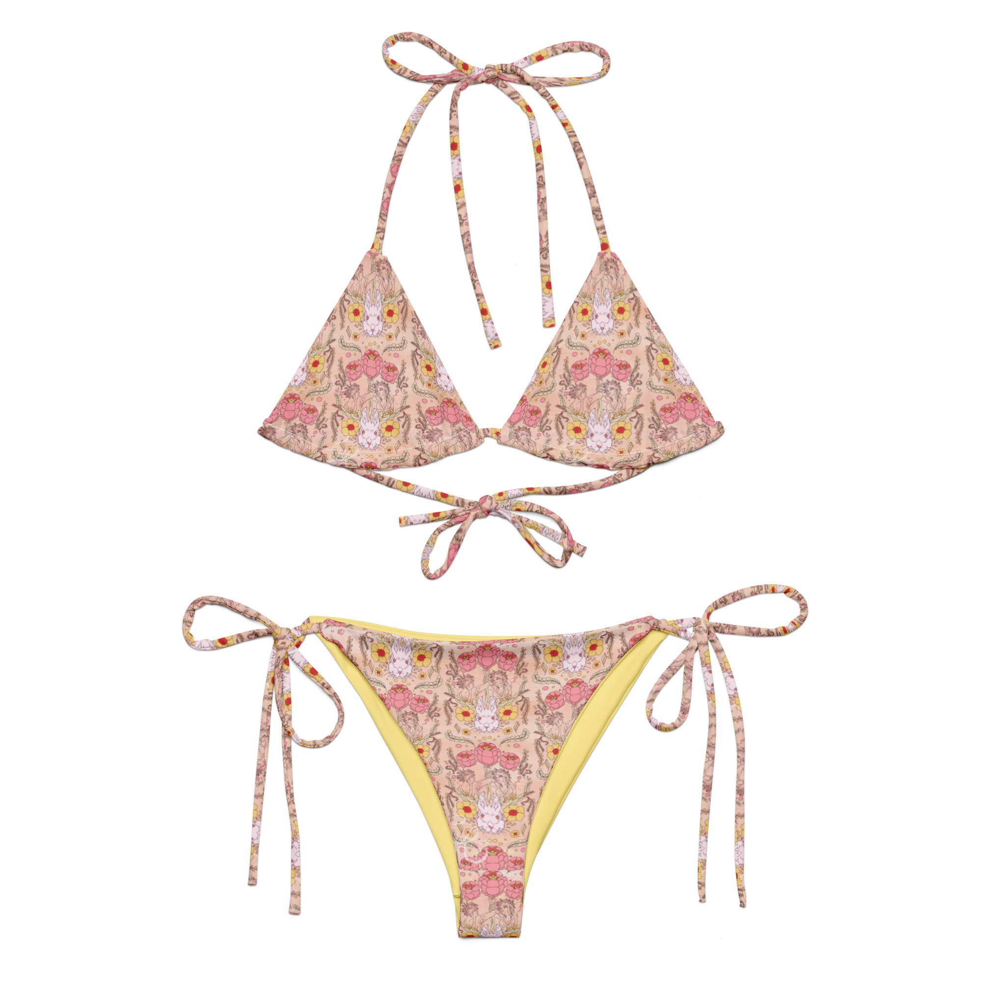 Swimsuits for everyone! This unique bikini showcases bunnies, a floral pattern, and loving witches celebrating spring.