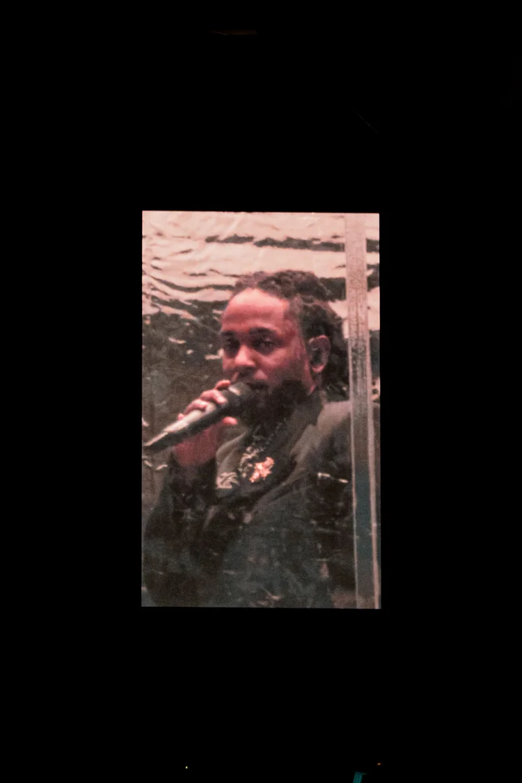 Performer behind a textured glass panel