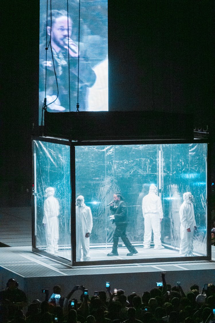 Performer in a glass enclosure