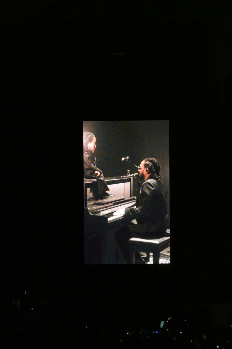 Piano performance on a dark stage