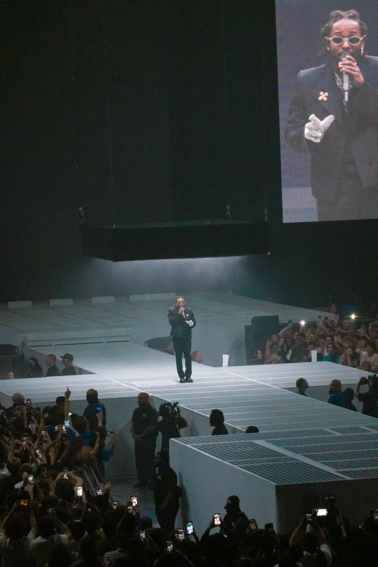 Performer with a close-up on screen