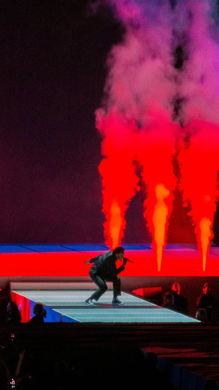Performer in red and blue light