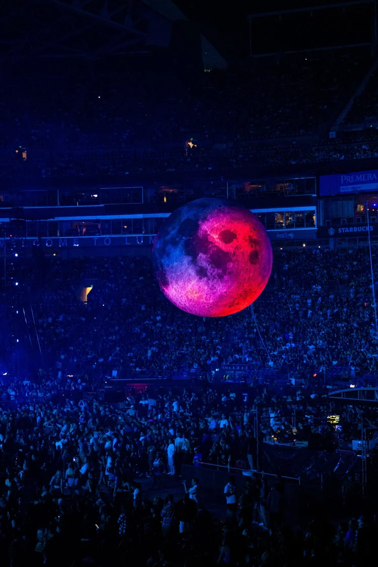 Stadium crowd with a moon balloon
