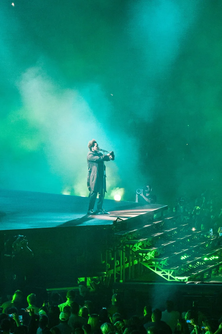 Performer under green lighting