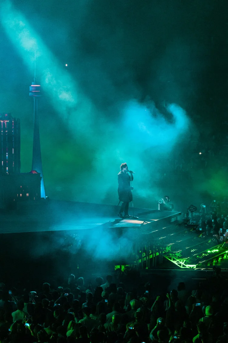 Singer under blue and green lights