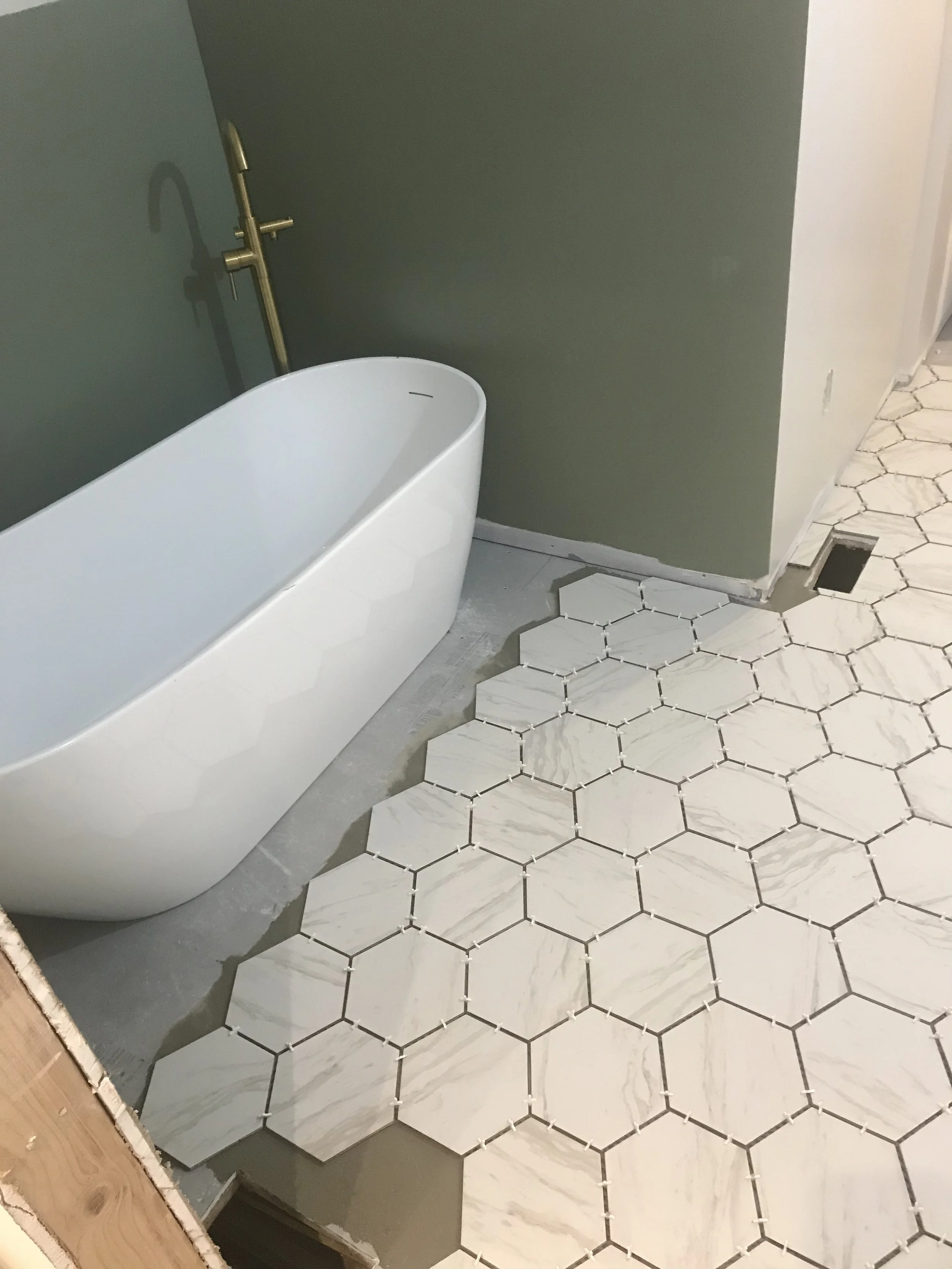Tile Floor and Bathtub Installation: Bathroom Remodel in Process