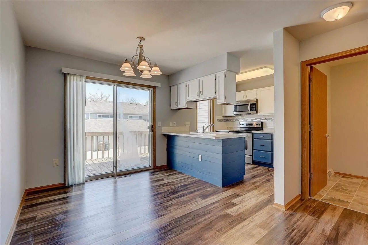 After: Refinished cabinets, countertop leveling, tile backsplash, shiplap finish on peninsula, new flooring_ Townhouse Kitchen