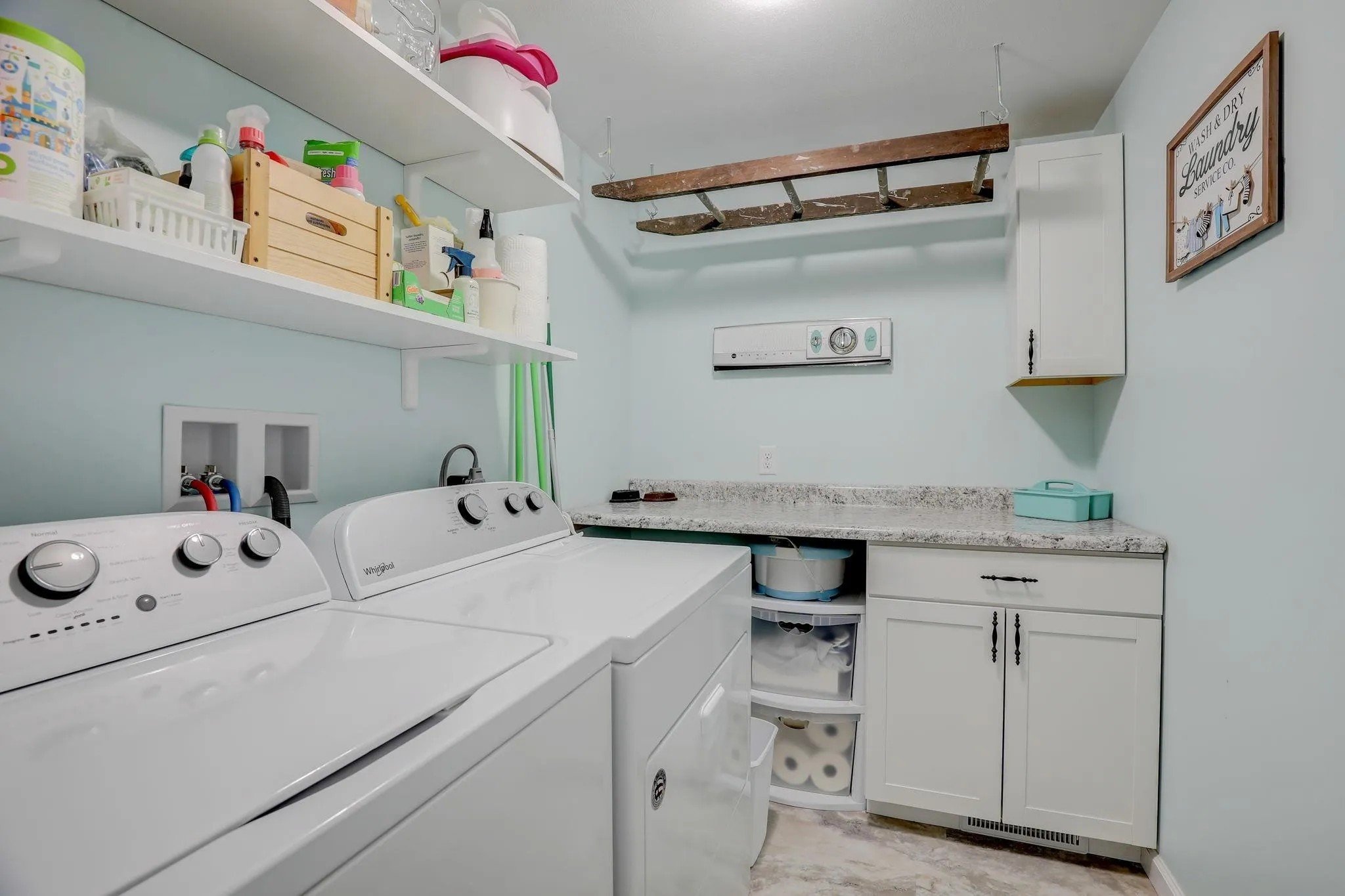 After: Laundry Room (previously part of family room)_ Knight House. New framing, flooring, paint.