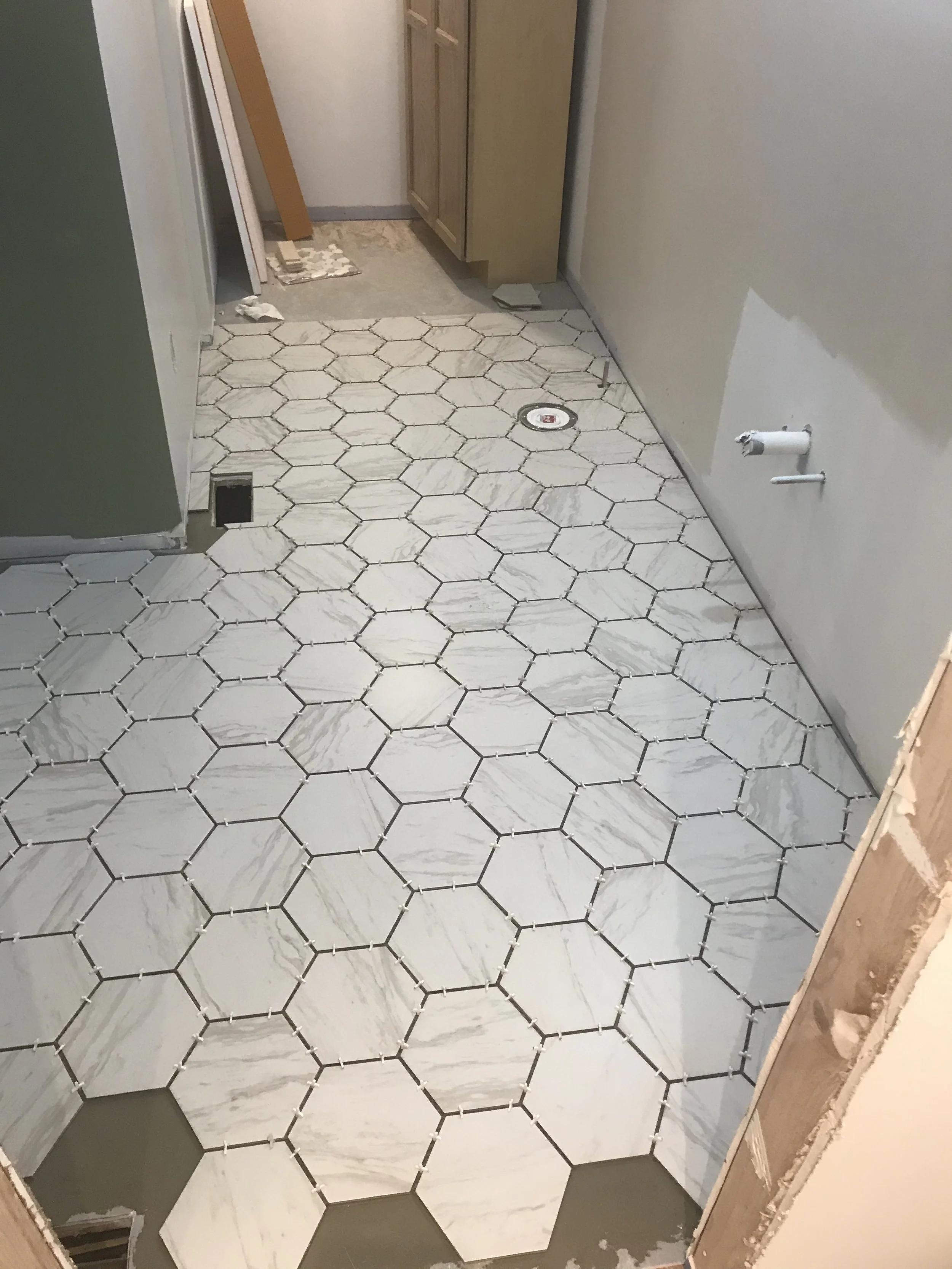Tile Floor Installation: Bathroom Remodel in Process