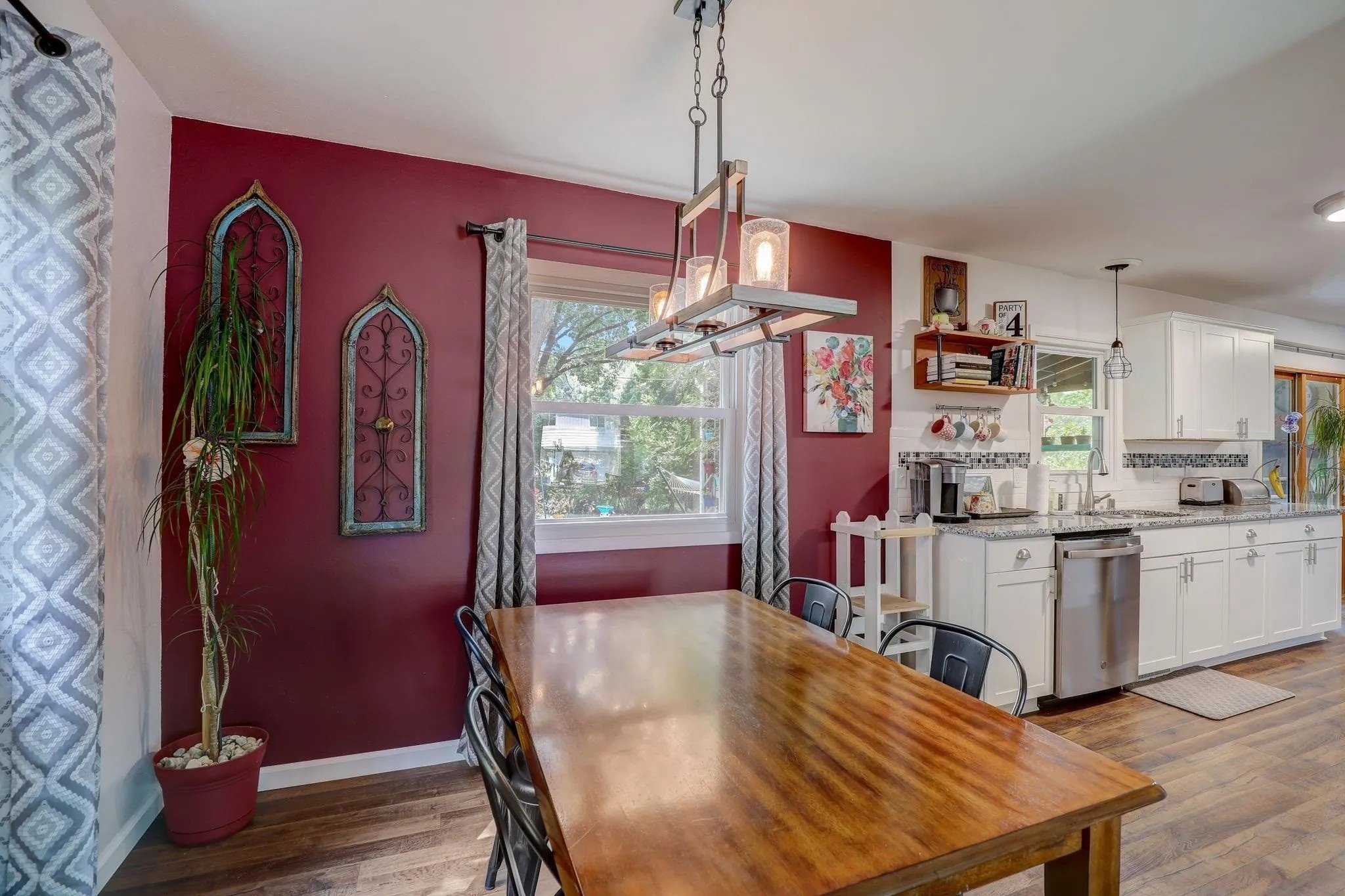 After: Dining Room, Kitchen_ Knight House. New flooring, paint, light fixtures.