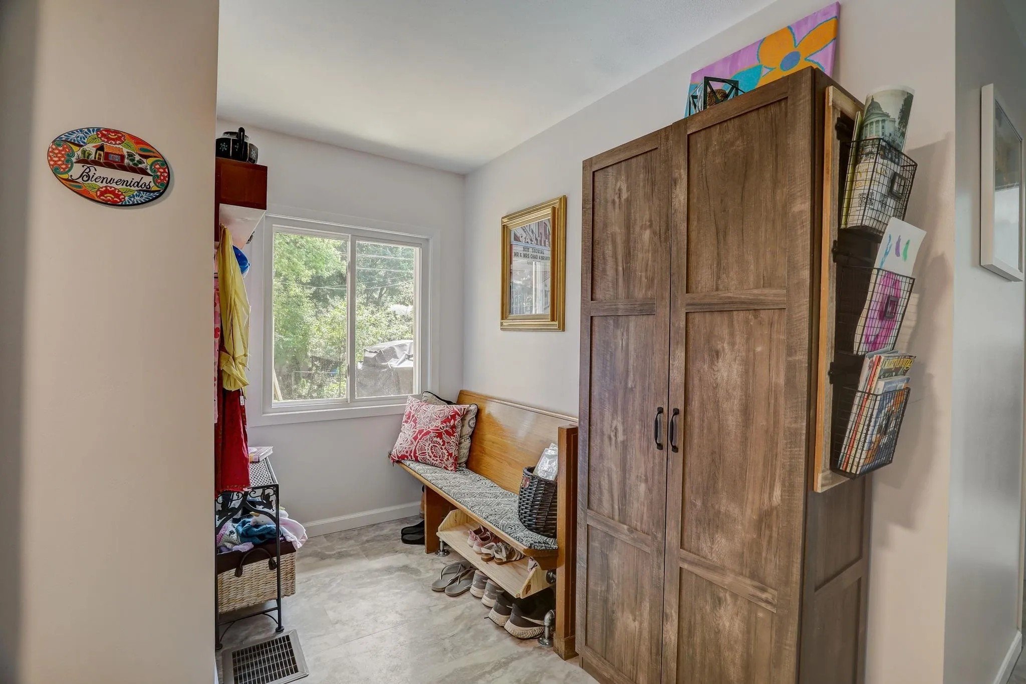 After: Entry (previously part of the family room). New flooring, window, paint, and lighting.
