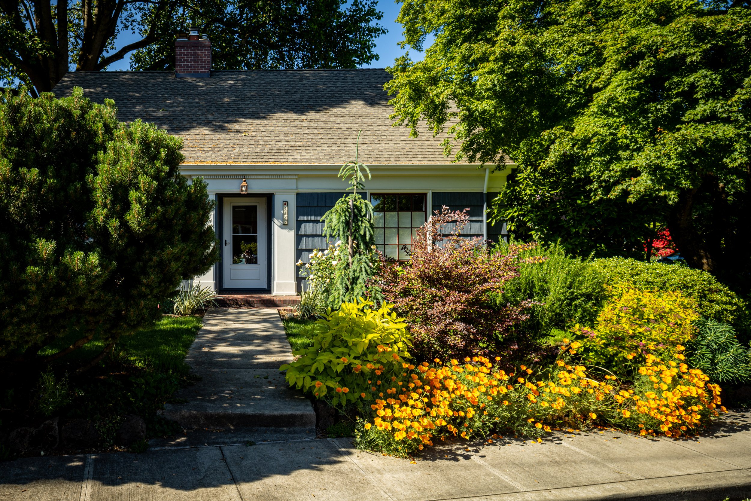 bungalow house with traditional detailing and gardens