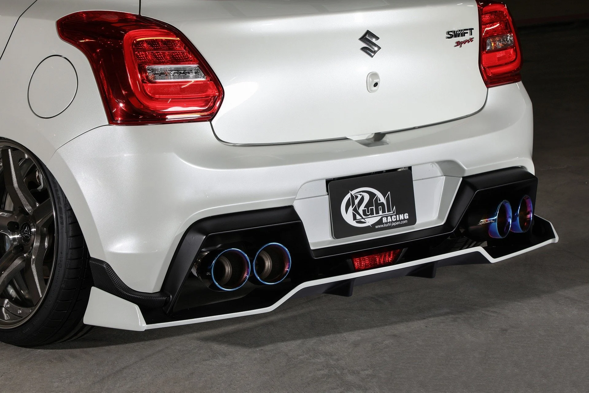 KUHL 33R-SS rear half spoiler and rear floating diffuser with four-tip exhaust on Suzuki Swift Sport ZC33S.