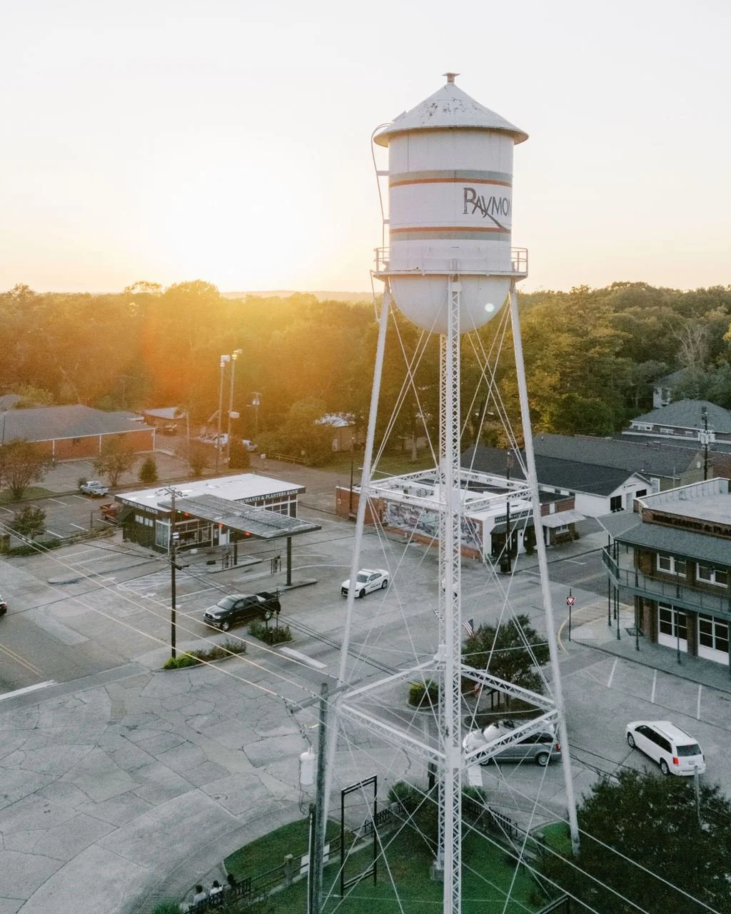 A historic 1920s building with a tall barrel ceiling, chippy brick, and spaces full of character &mdash; inside and out.
Old, established trees. A walkable small-town square. Photo ops everywhere.

Tucked into downtown Raymond, it&rsquo;s the kind of