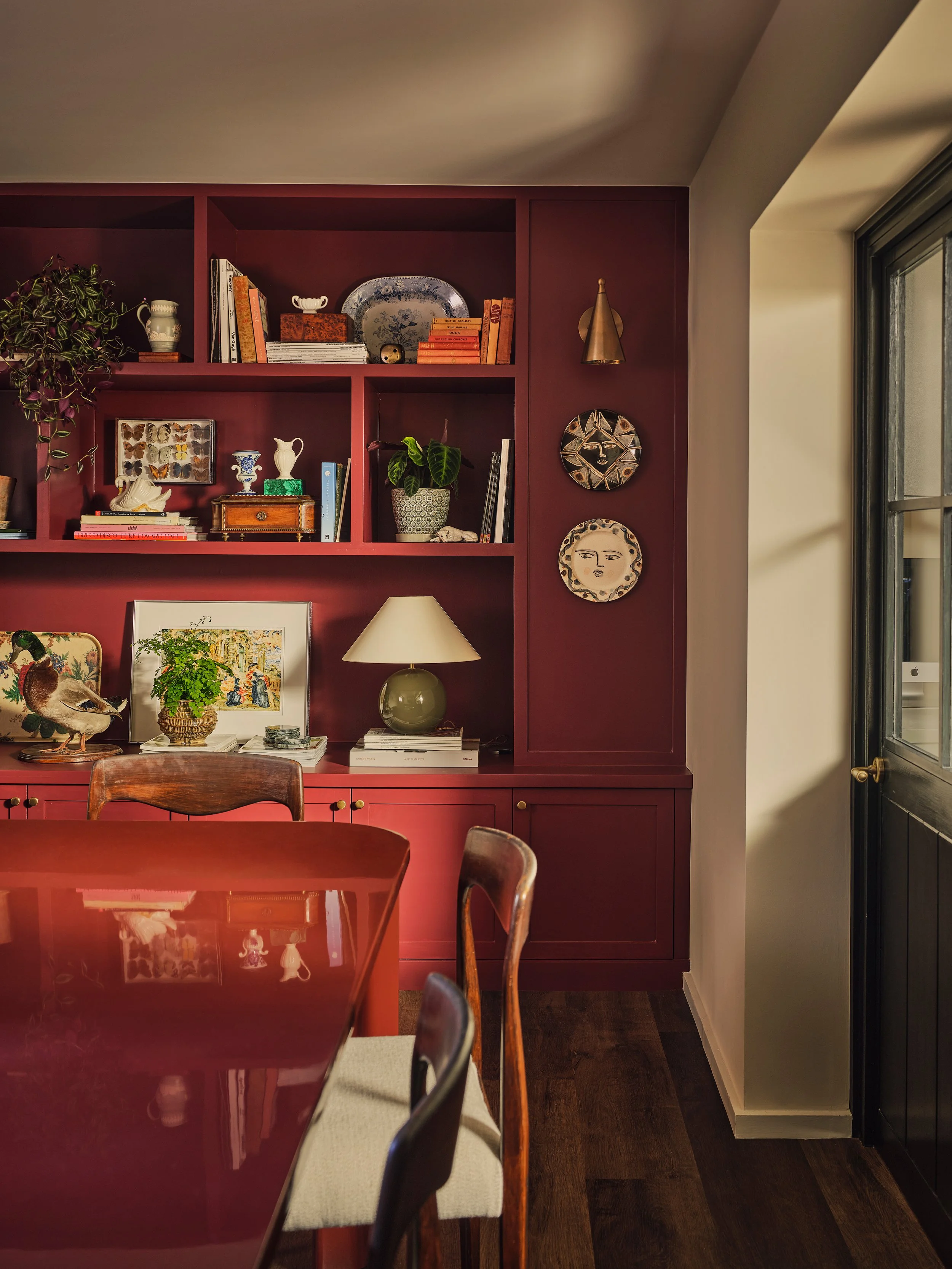 Rich burgundy joinery, collected objects, and warm tonal styling in intimate interior space.
Interior design London
Interior Design UK
Top 100
Top 101
Residential interior designers
Best interior designers in London
Primeresi 
House and Garden 
Elle 