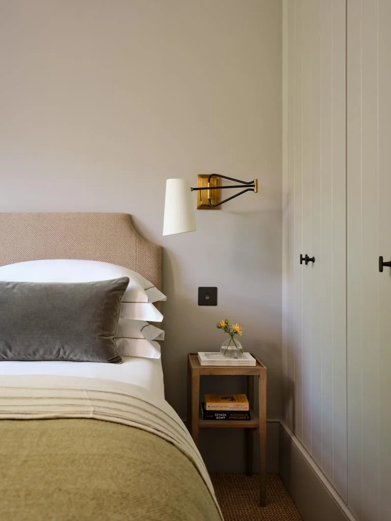 Serene bedroom in London townhouse with soft neutral palette
