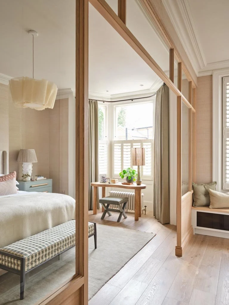 Light-filled bedroom with understated, refined interior styling