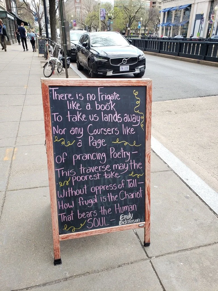 Signboard with "There is no Frigate like a Book" by Emily Dickinson