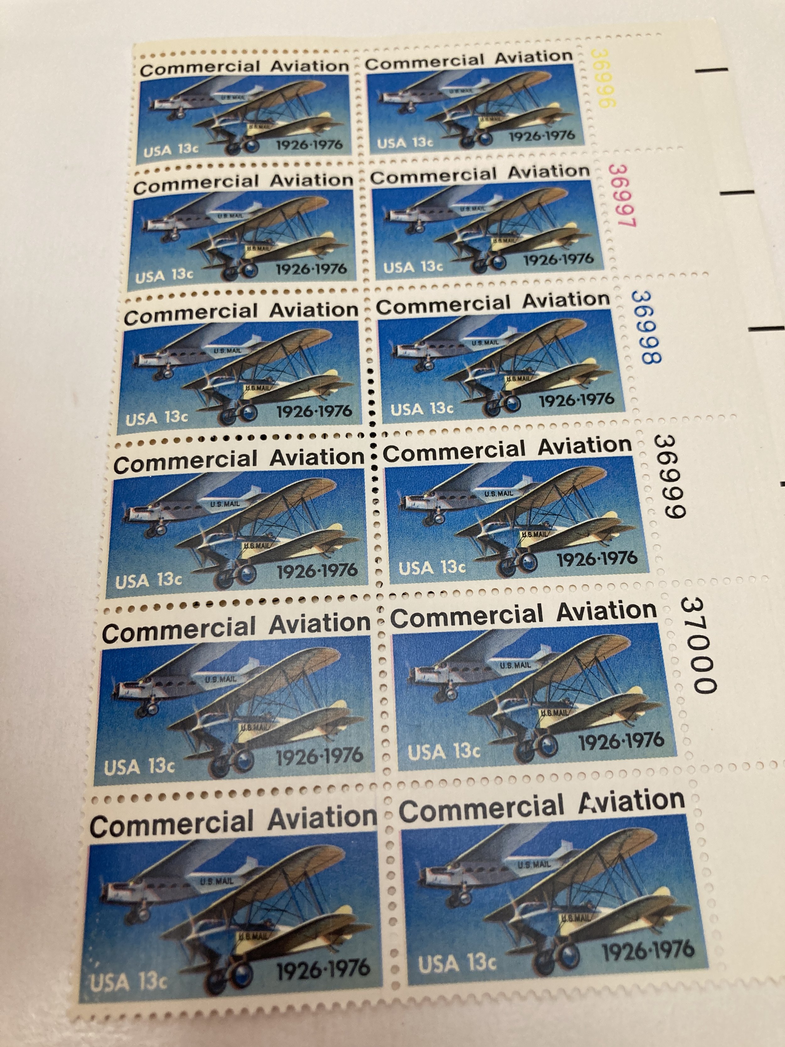 U.S. 13 cent stamp commemorating the history of Commercial Aviation, designed in 1976 by Robert E. Cunningham in honor of the 50th anniversary of the first contract airmail flights. (Personal collection)  