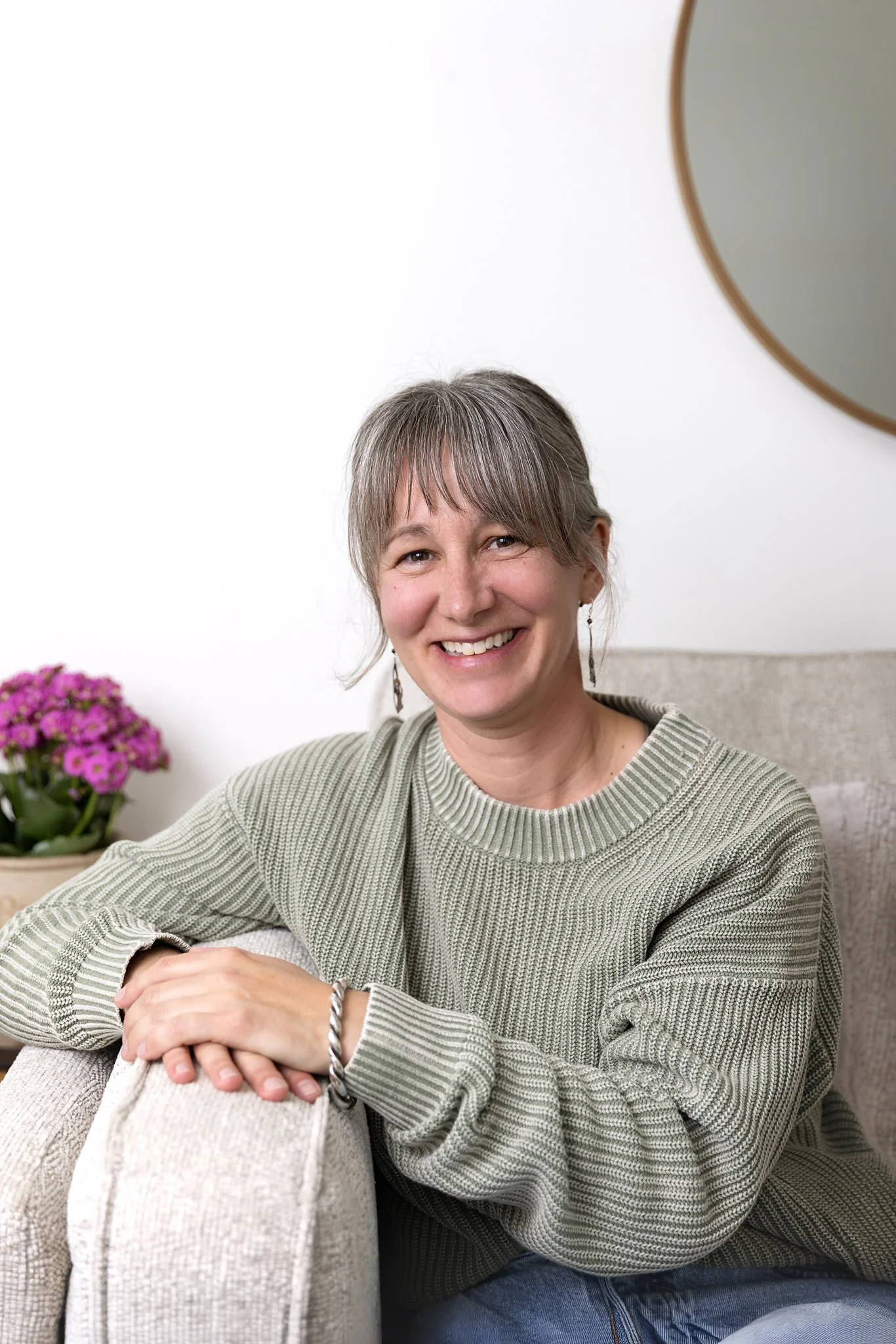 Jenny Fremlin smiling in her counselling office in Salmon Arm, BC.
