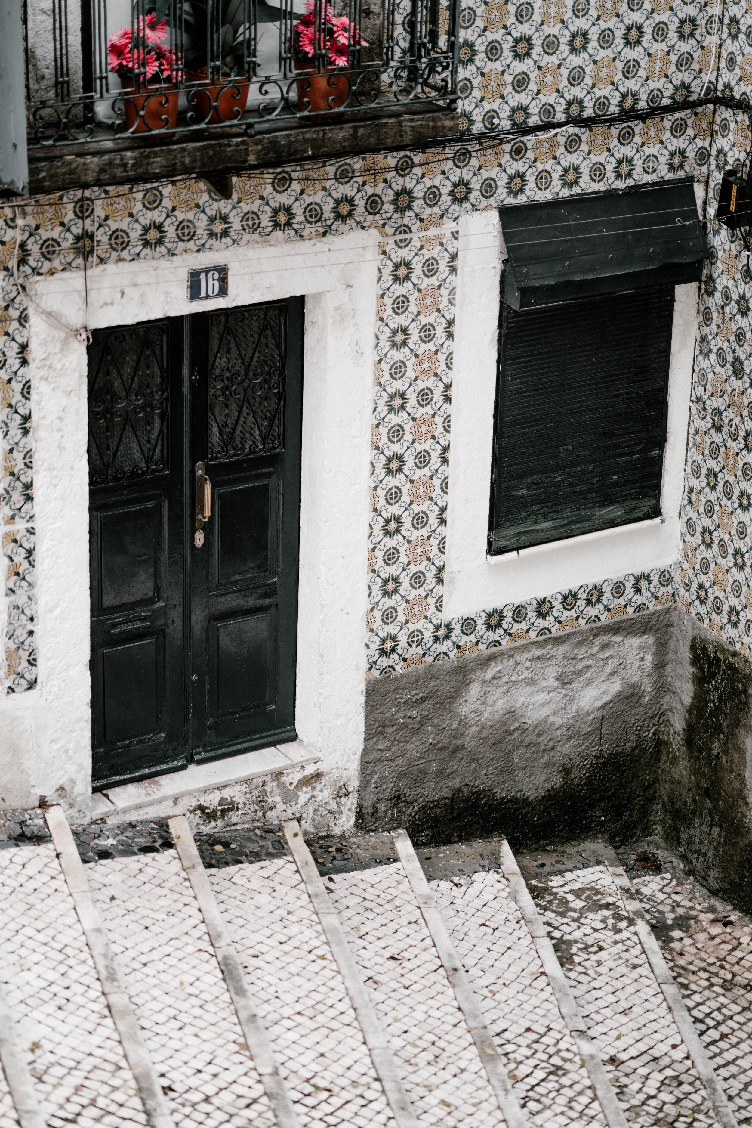 Lisbon tiles in alleyway annie spratt unsplash.jpg
