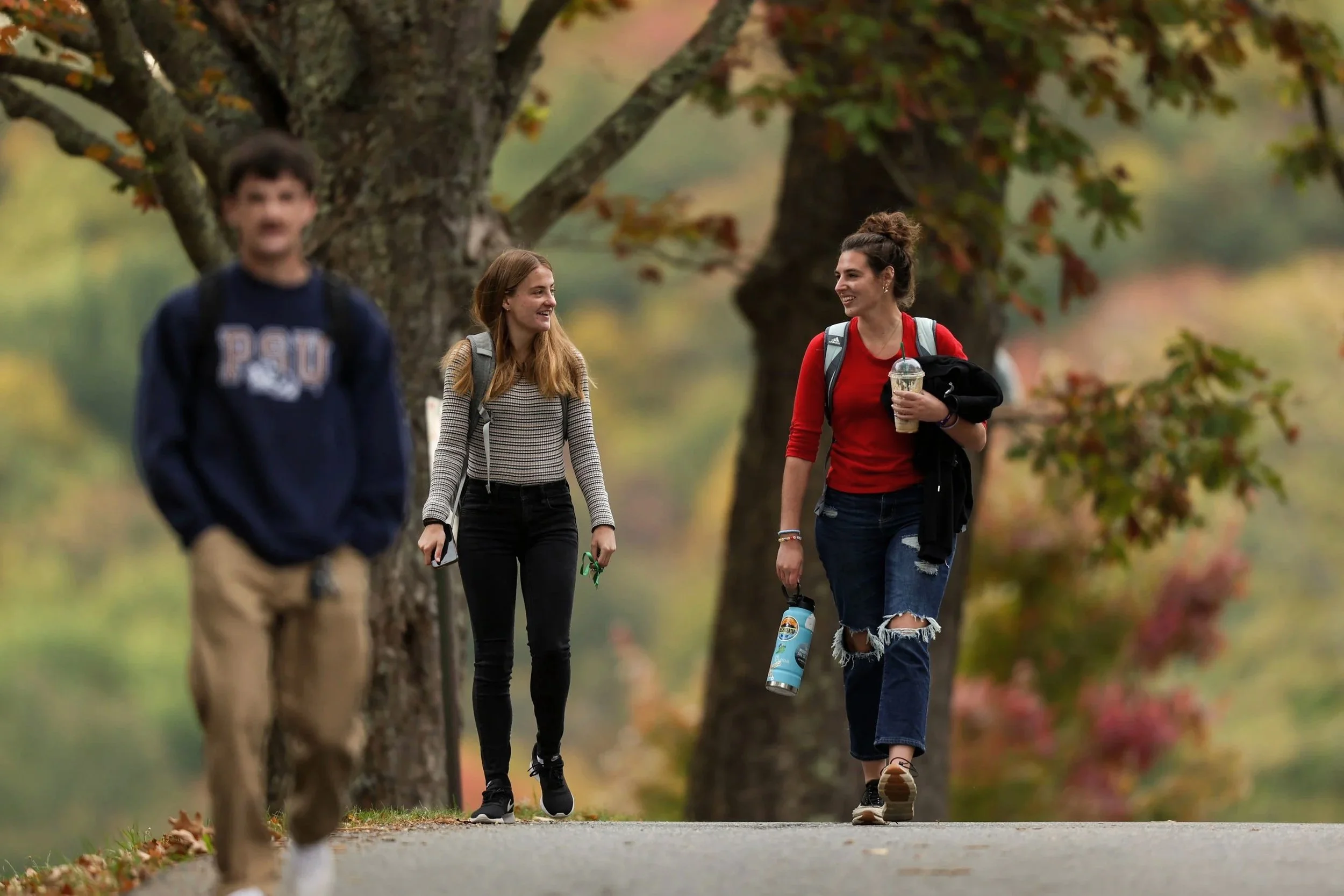 Deanna Betzer and Kaitlyn Rowe engage in
conversation while on their way to class at
Lees-McRae College.