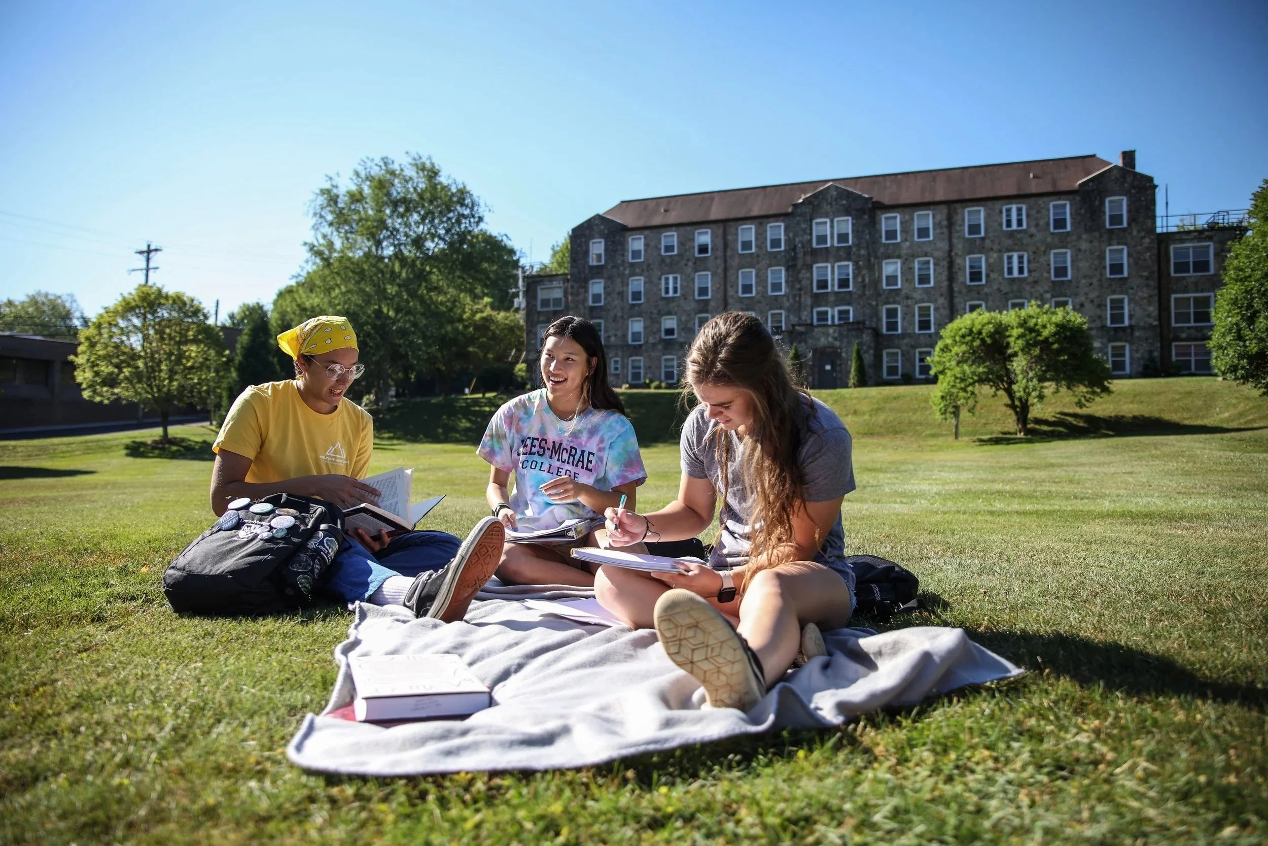 Three students get up early to study on Tate
Lawn on a September morning in 2021.