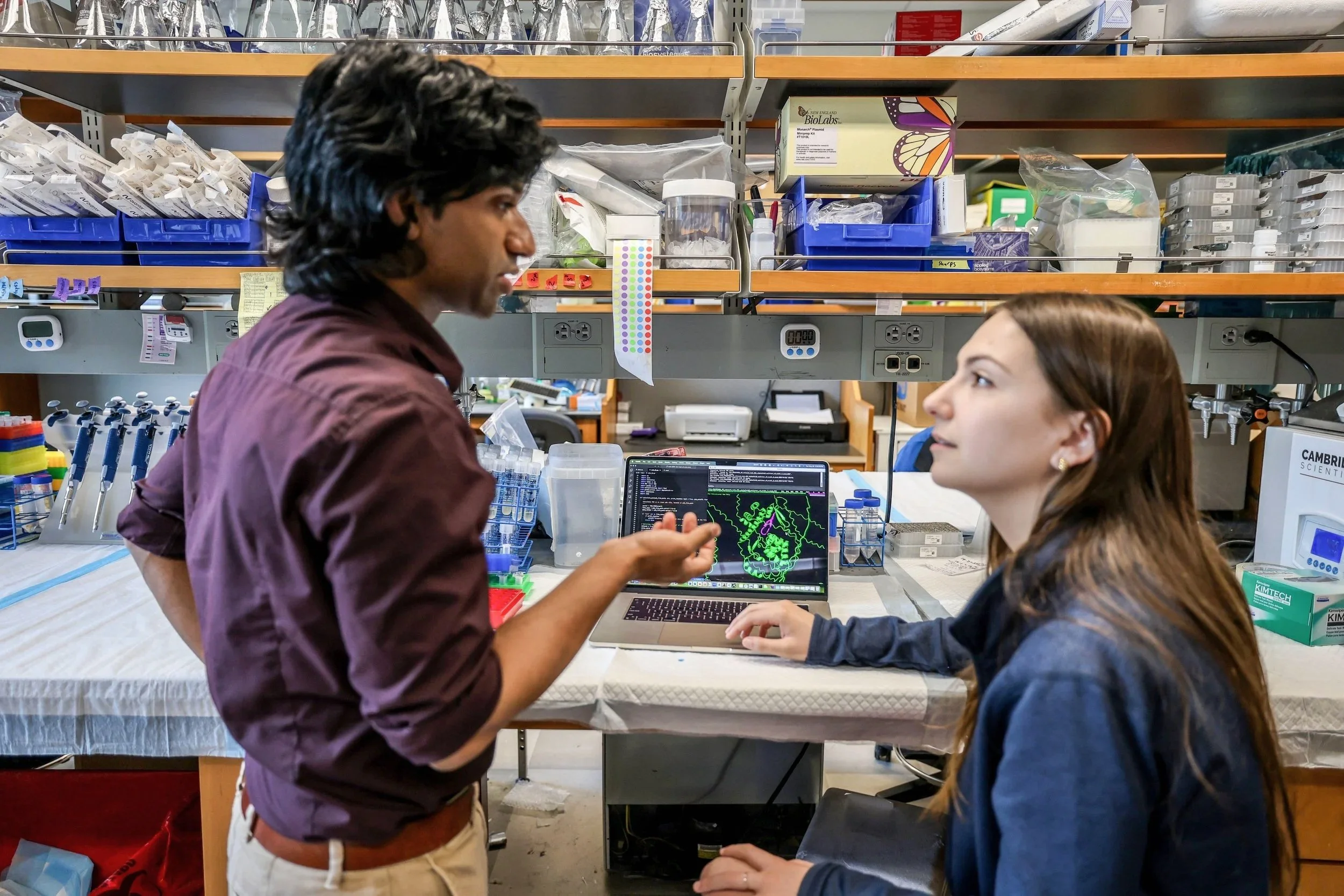 Pranam Chatterjee, Assistant Professor of
Biomedical Engineering at Duke University,
discusses a research problem with his
graduate assistant.