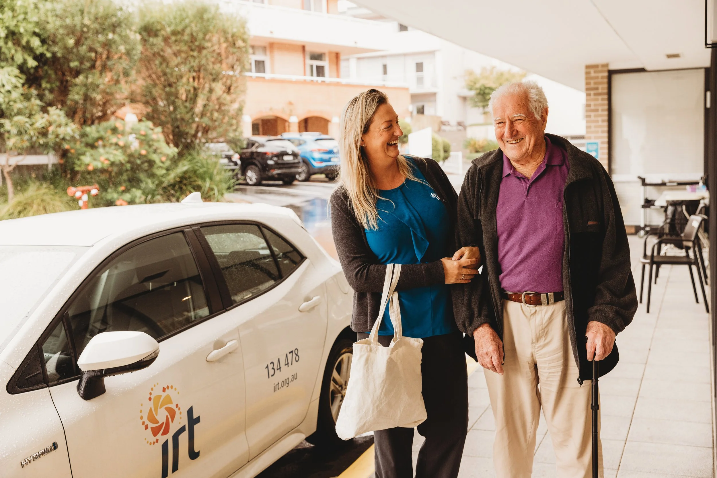Professional Corporate Branding photo shoot for IRT featuring a nurse assisting an elderly gentleman that has been used in extensive corporate marketing campaigns across Australia