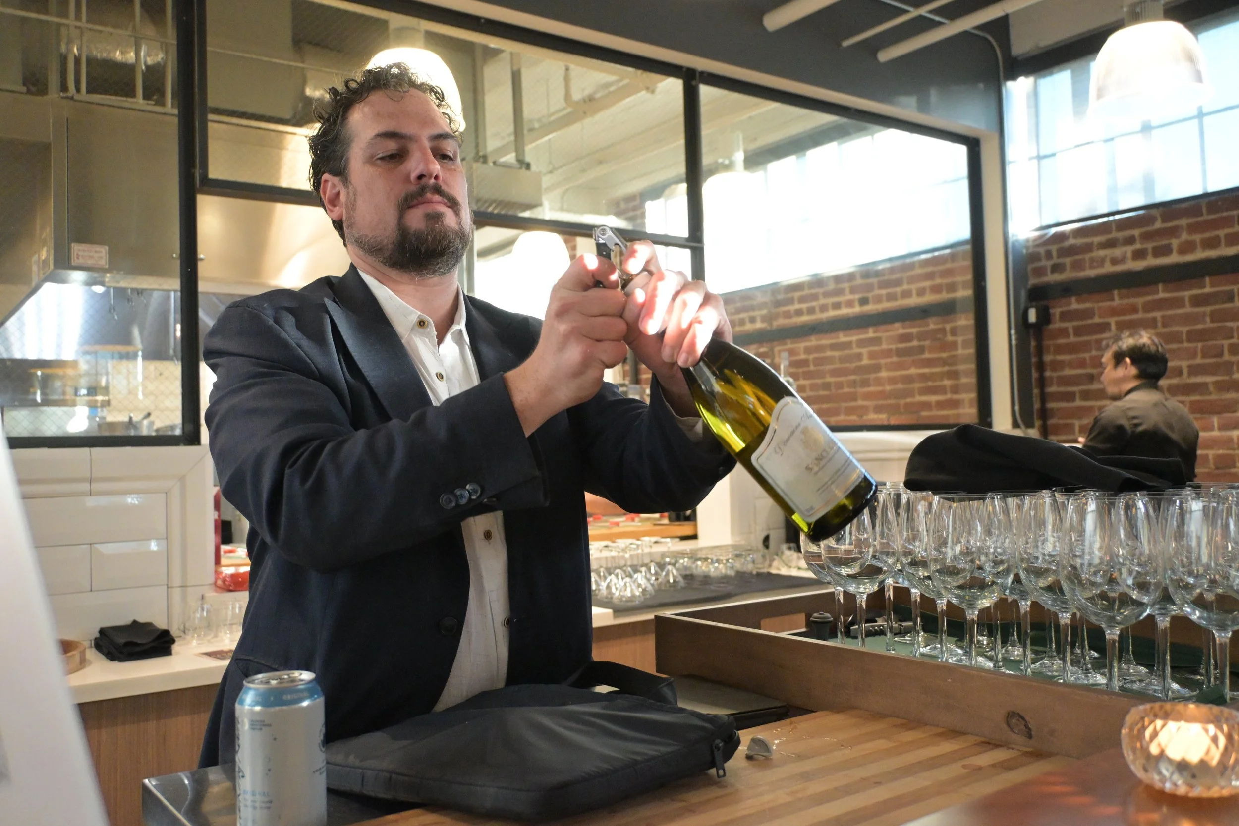 Aziz opening wine 2.JPG