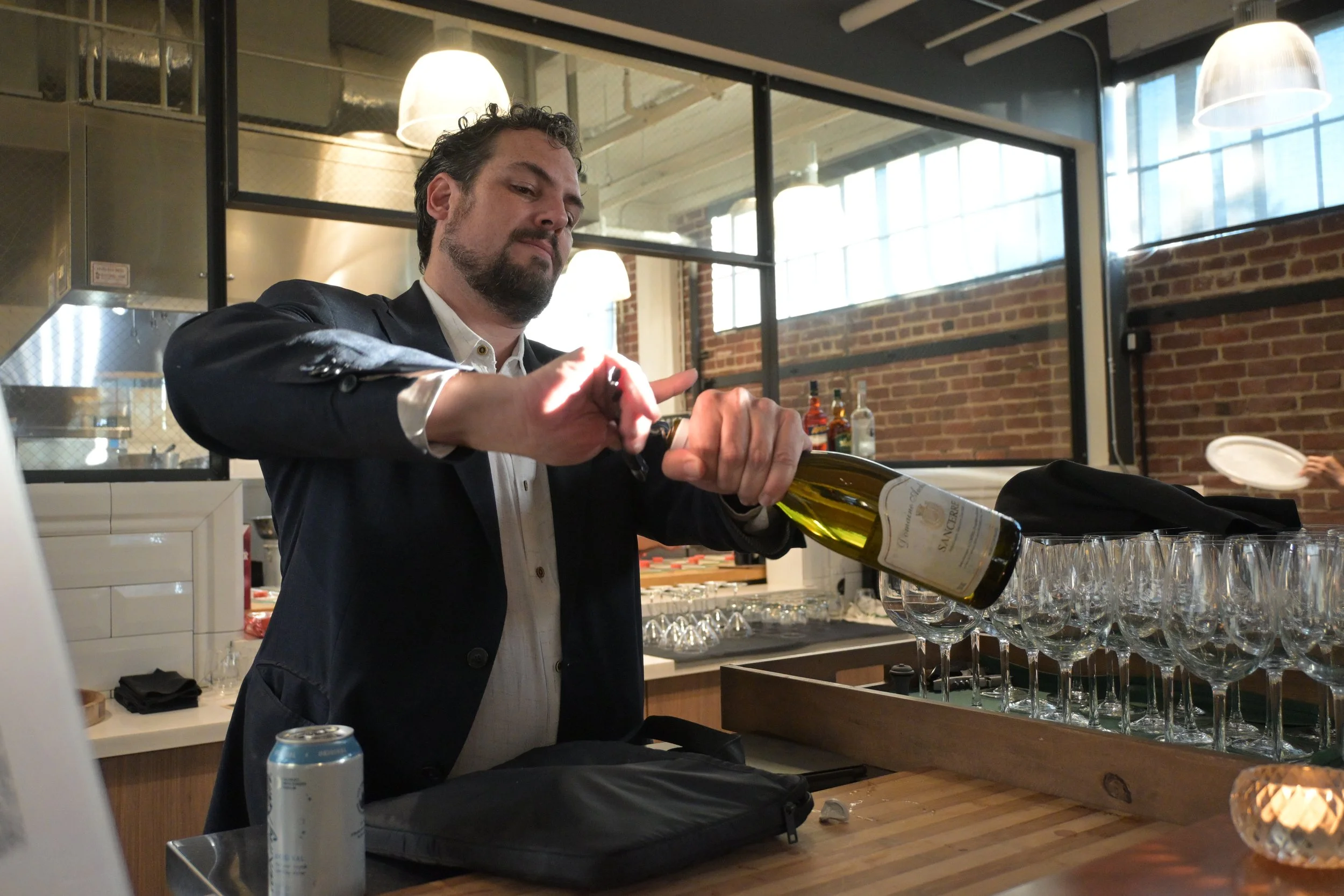 Aziz opening wine.JPG