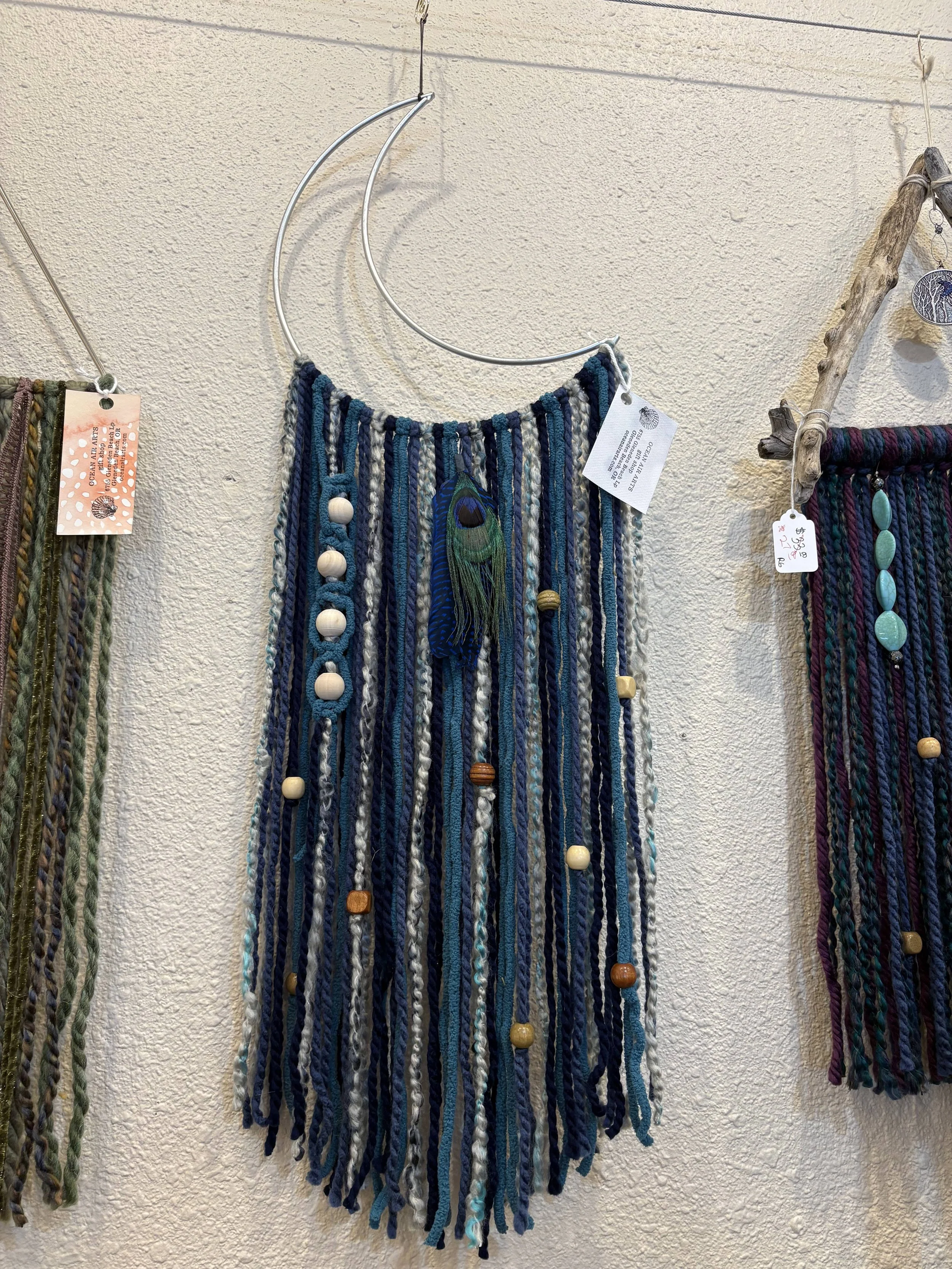 yarn, beads, and other embellishment wall hangings