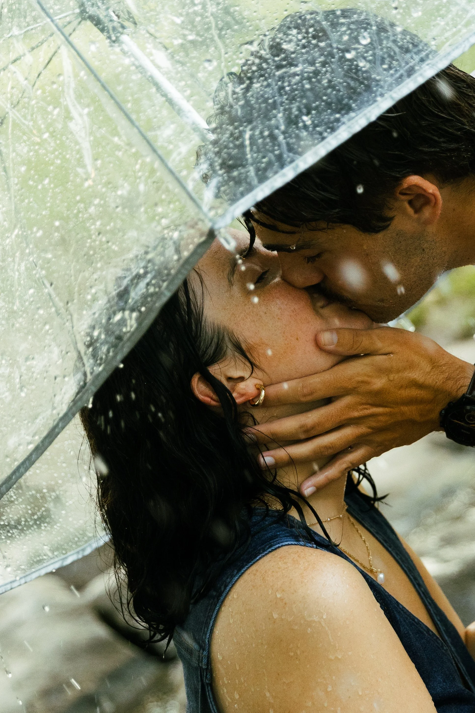 Couple kissing in the rain